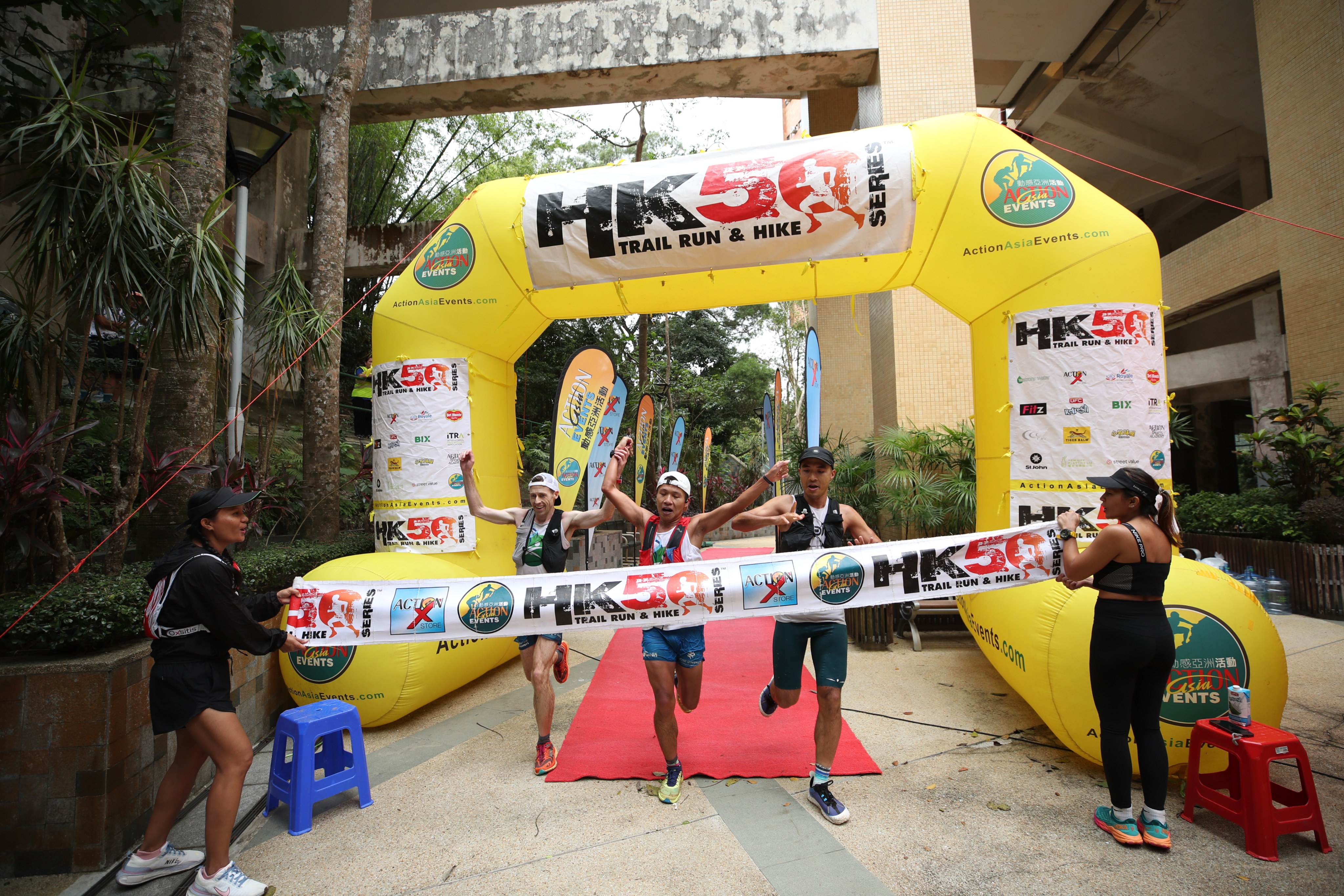 Jeff Campbell, Chan Ka-keung and Wong Wai-hung cross the finish line together to win the men’s race of the HK50 Series event on Hong Kong Island. Photo: Action Asia Events