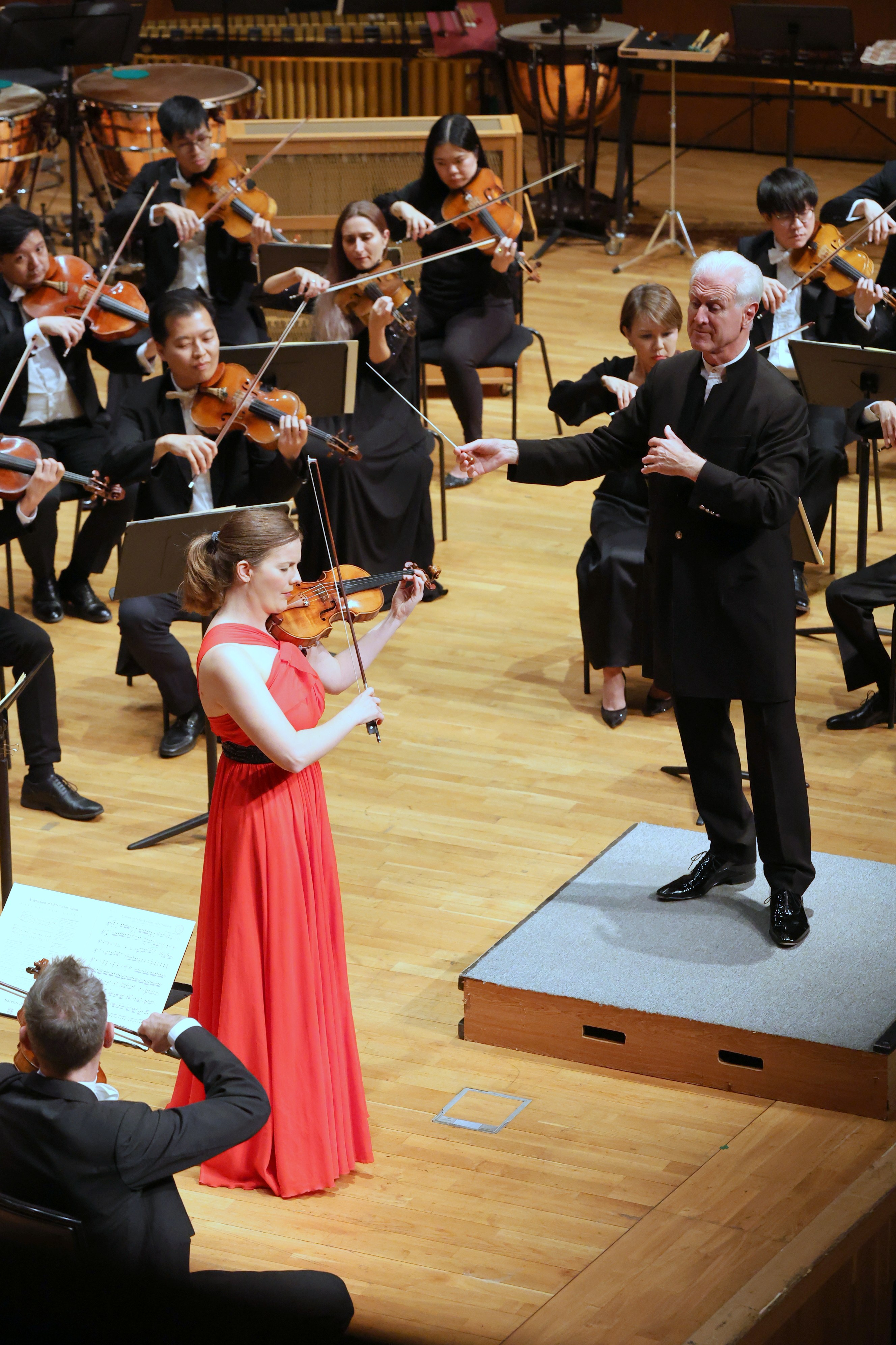 German violinist Veronika Eberle performs with the Hong Kong Sinfonietta under the baton of its music director, Christopher Poppen, in a concert of concertos by Hosokawa and Mozart and symphonies by the latter and by Schubert. Photo: Hong Kong Sinfonietta 