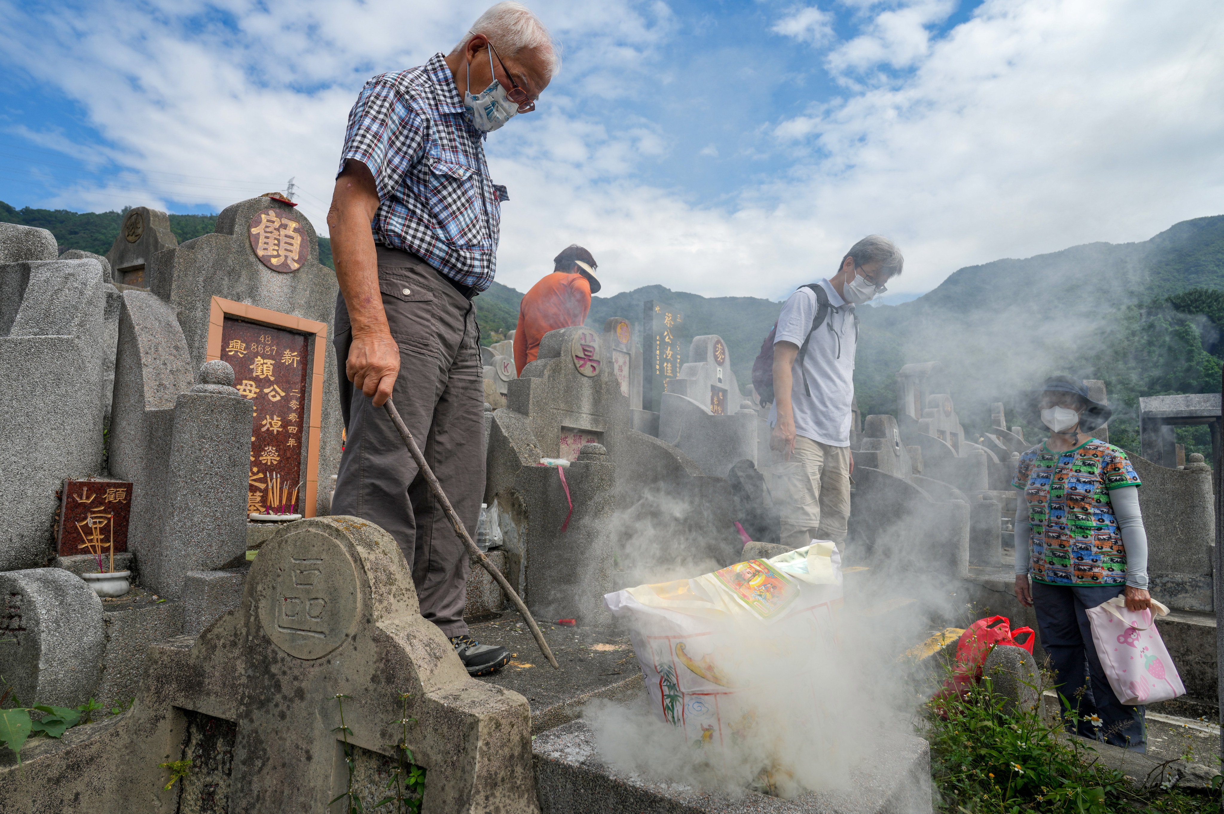 Grave sweepers in Hong Kong on Chung Yeung Festival. Photo: Sam Tsang