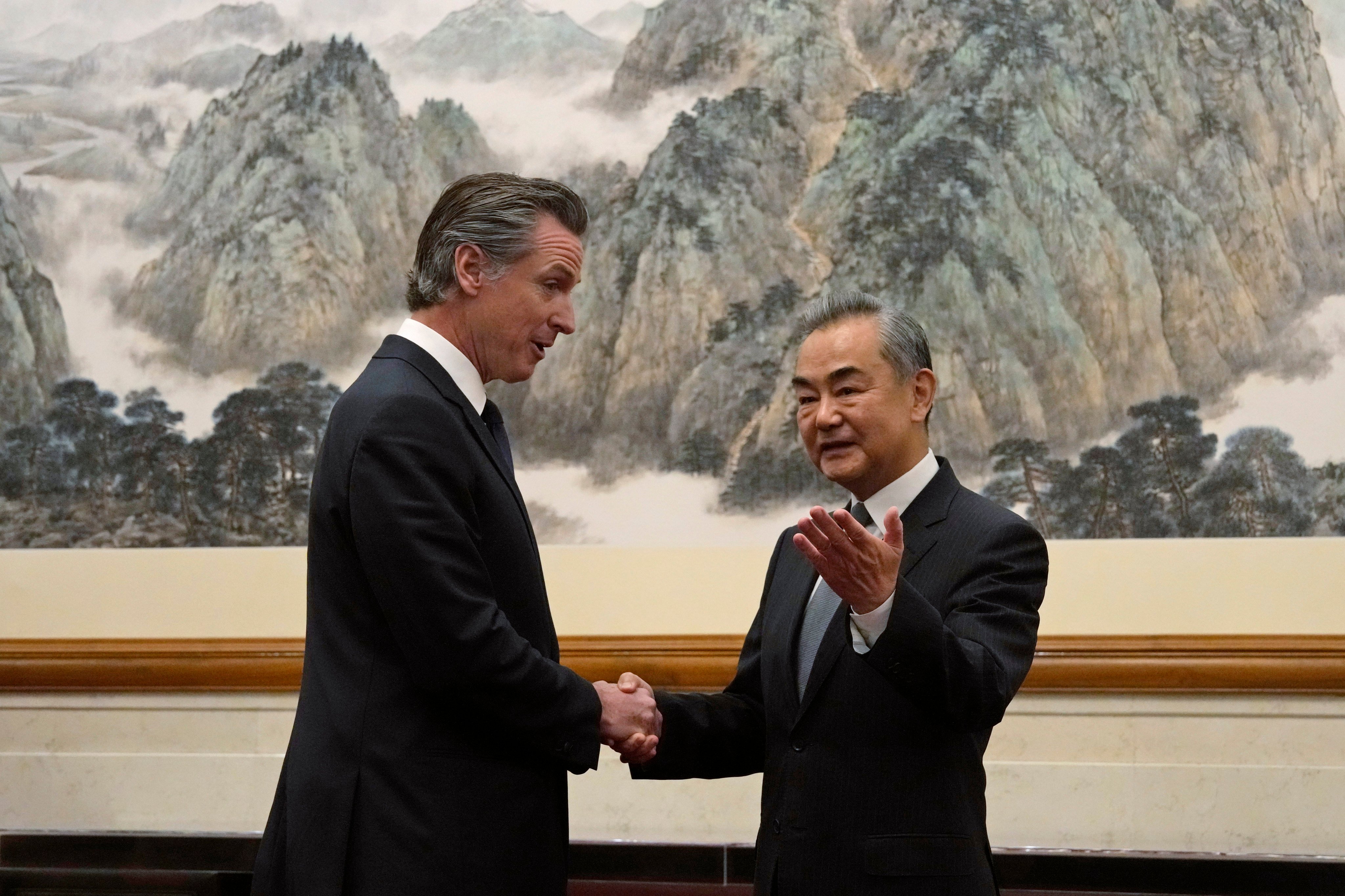 California Governor Gavin Newsom shakes hands with Chinese Foreign Minister Wang Yi in Beijing on Wednesday morning. Photo: AP