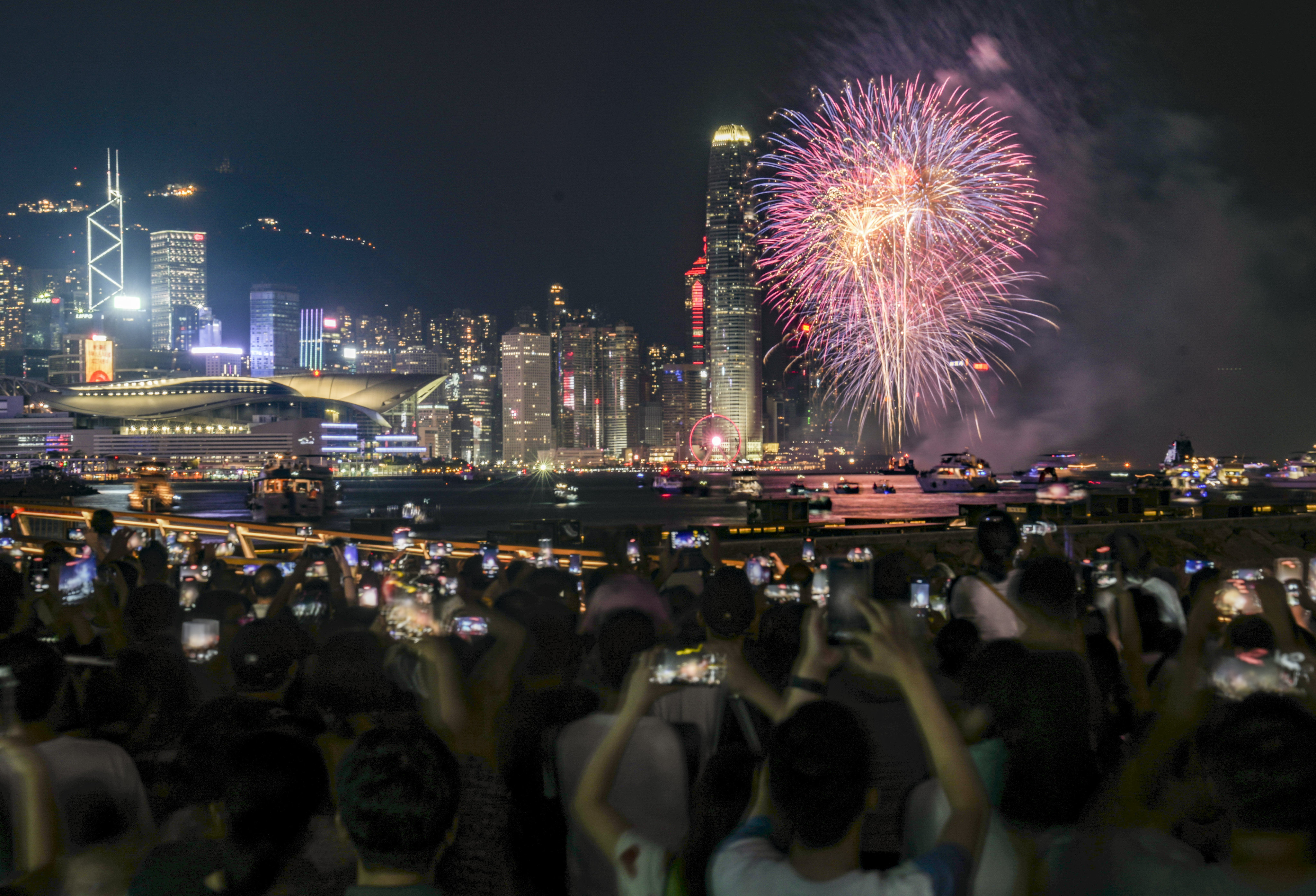 People gather in Hong Kong’s North Point district for the National Day fireworks display on October 1. Photo: Sam Tsang