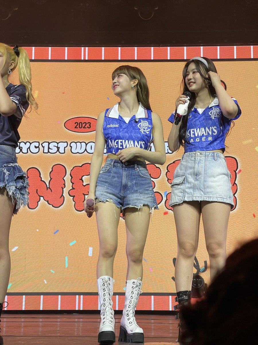 Two members of K-pop group STAYC shown wearing Glasgow Rangers shirts during a concert in Dallas. Photo: X/@worldsoccertalk