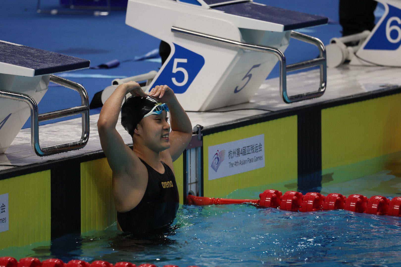 Chan Yui-lam of Hong Kong celebrates her women’s 100 metres butterfly S14 gold. Photo: China Hong Kong Paralympic Committee