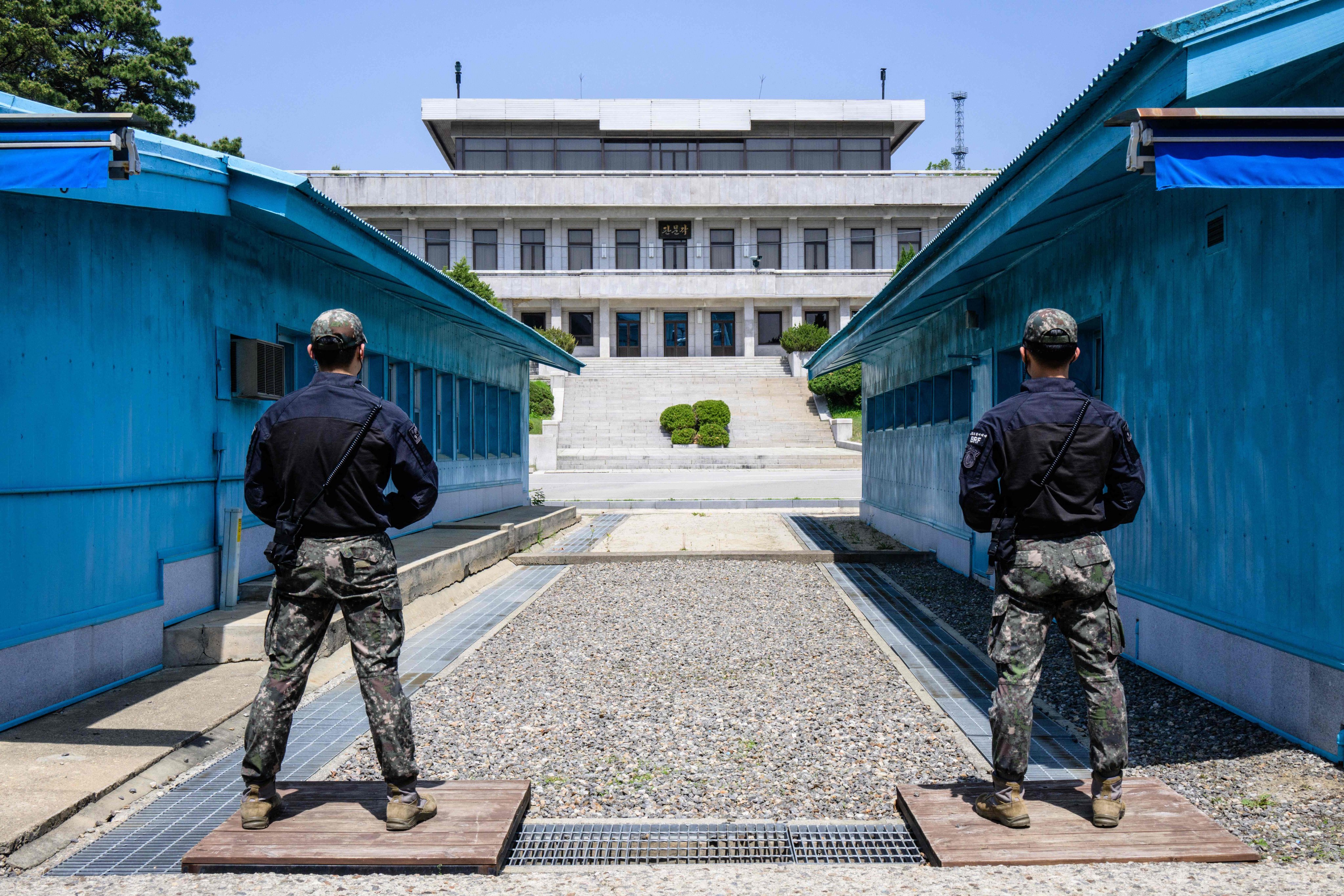 South Korean soldiers stand guard as they face North Korea’s Panmon Hall at the truce village of Panmunjom in the demilitarised zone separating North and South Korea on May 9. With Russia’s invasion of Ukraine grinding to a standstill, advocates for a ceasefire are looking to Korea, Kashmir and Cyprus for ideas on how to sustain a halt to hostilities. Photo: AFP