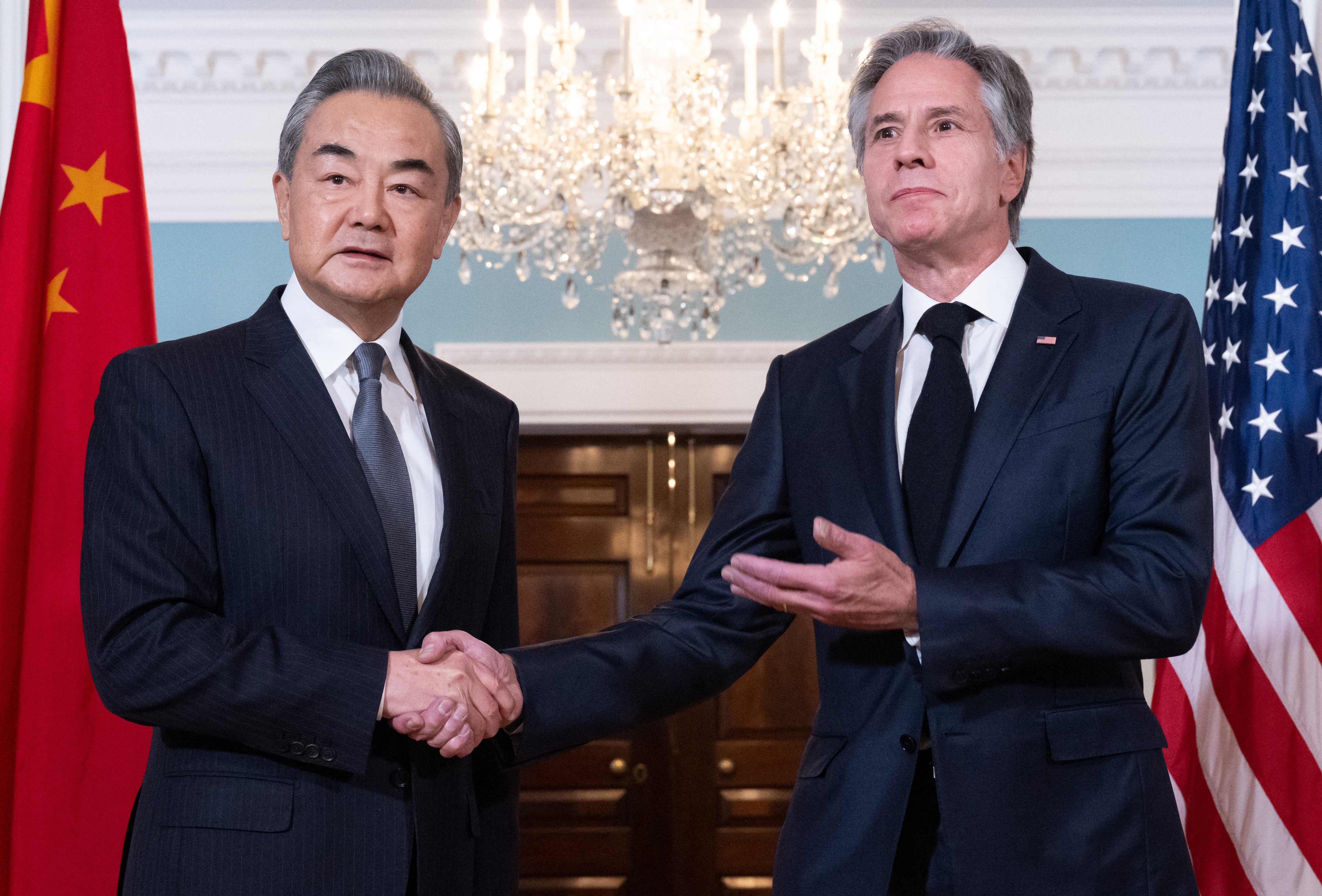 Chinese Foreign Minister Wang Yi and US Secretary of State Antony Blinken shake hands before their meeting at the State Department in Washington on Thursday. Photo: AFP