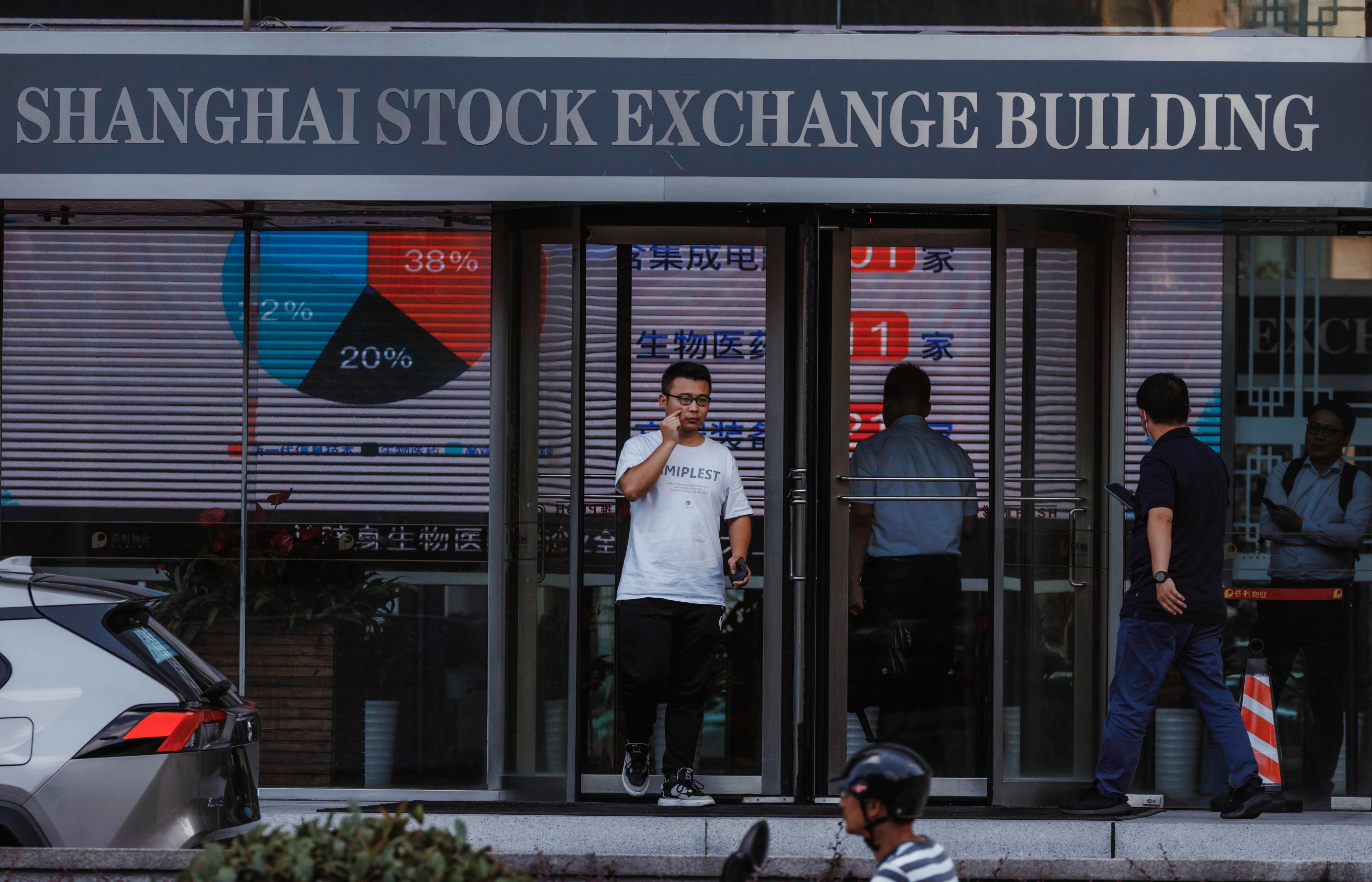 People walk past the Shanghai Stock Exchange building in August 2023. Photo: EPA-EFE