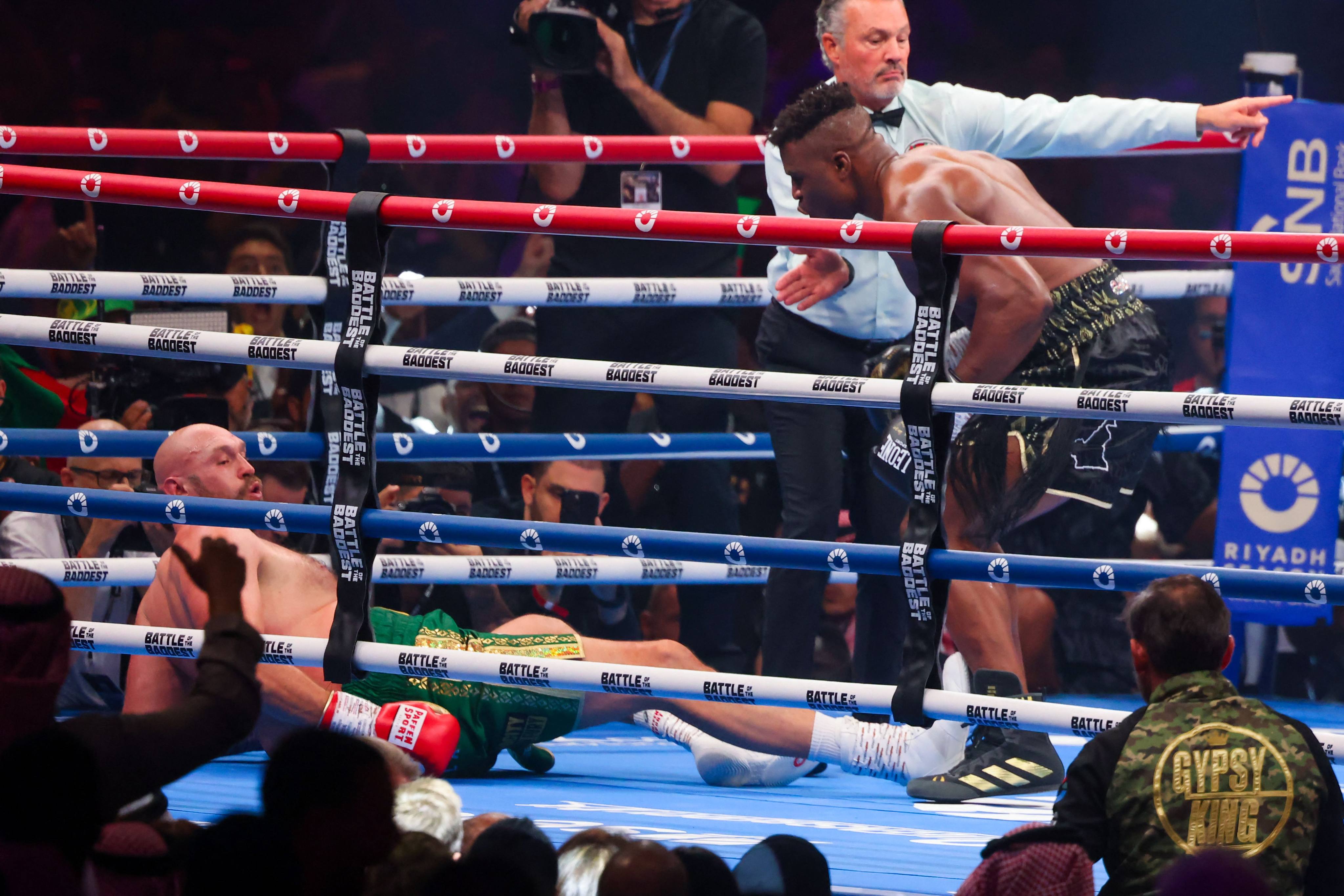 Francis Ngannou taunts Tyson Fury after knocking him down in their heavyweight boxing match in Riyadh. Photo: AFP