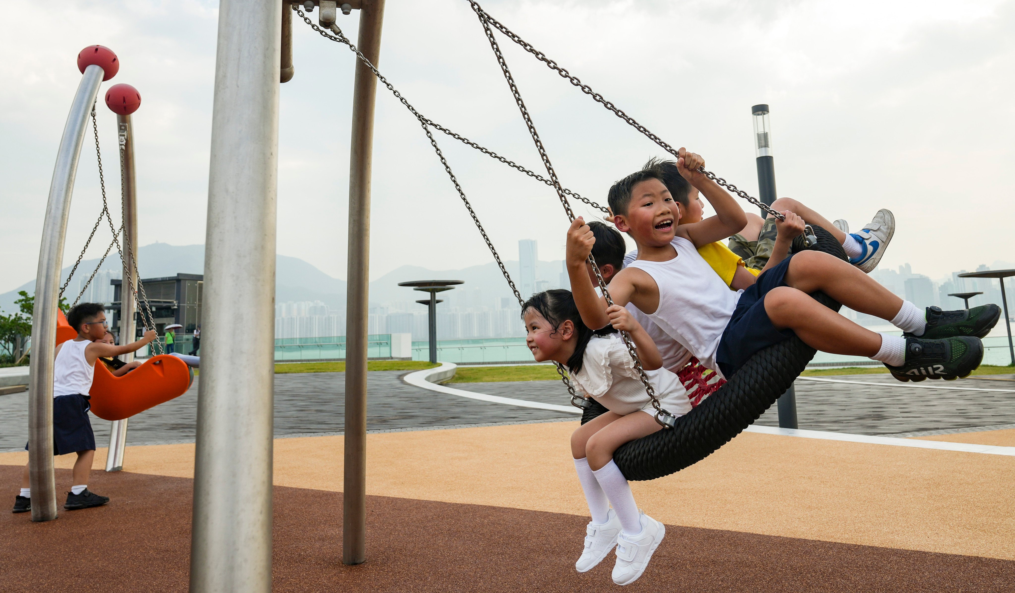 Children enjoy the Cha Kwo Ling Promenade in Hong Kong on September 4. Photo: Sam Tsang