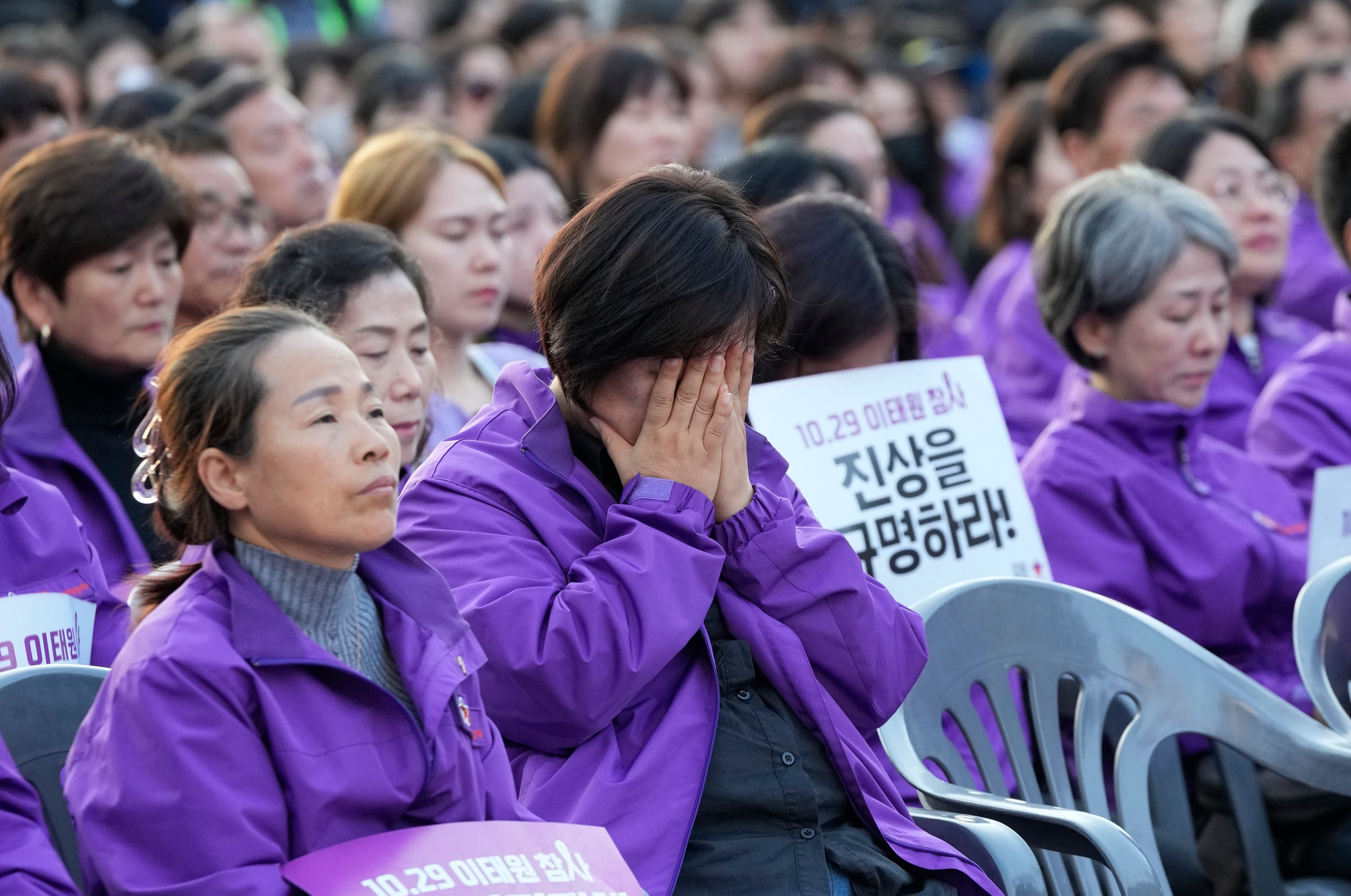Family members of victims mark the first anniversary of the Halloween crowd surge that killed 159 people in a Seoul alleyway. Photo: AP