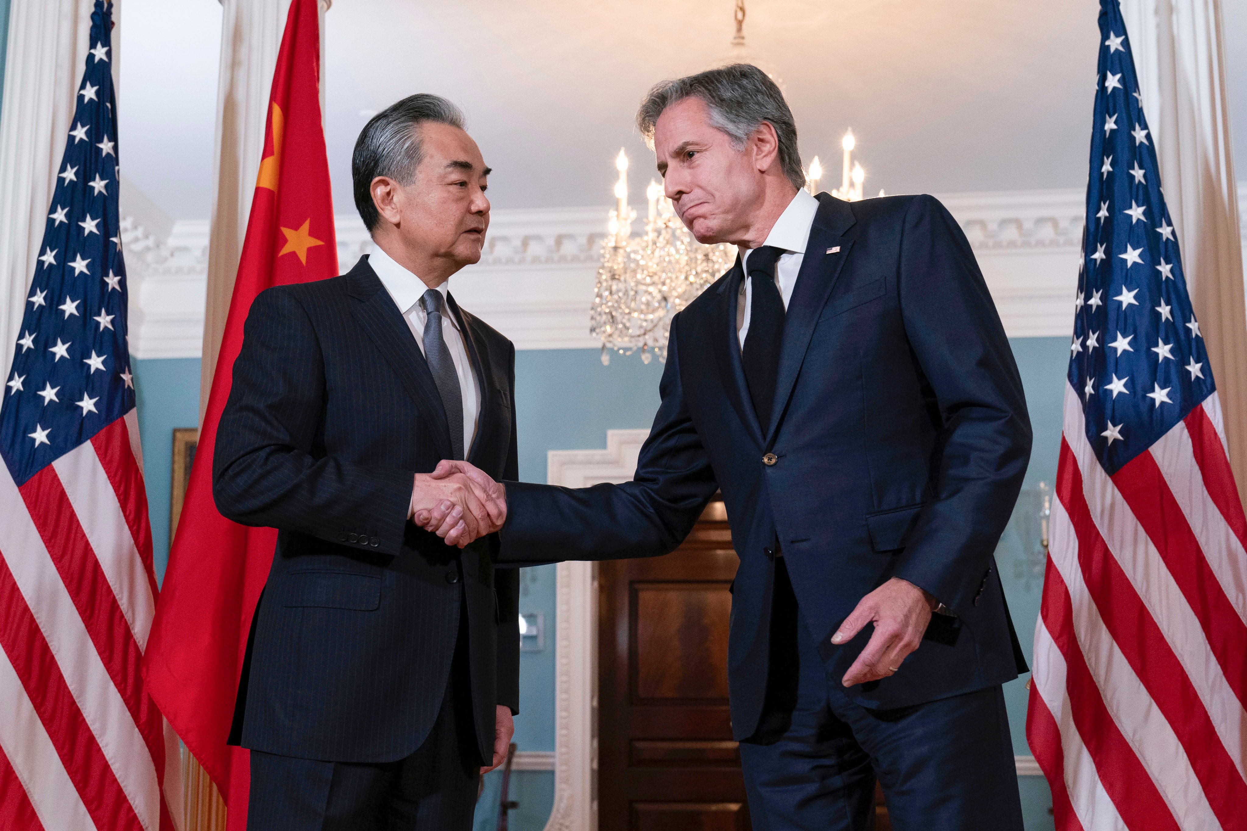 Foreign Minister Wang Yi shakes hands with US Secretary of State Antony Blinken after a meeting at the State Department in Washington on October 26. Photo: AP