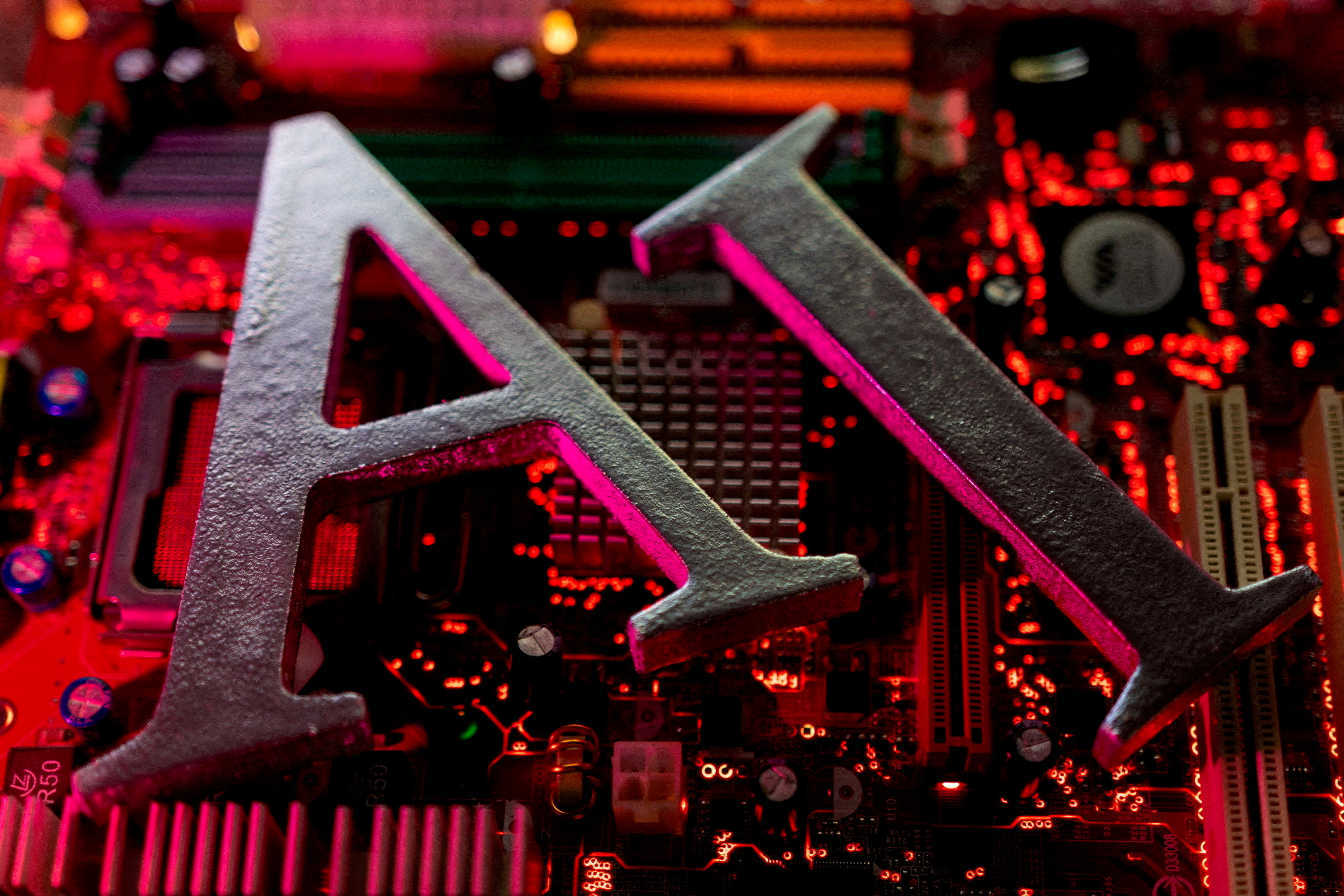 AI letters are placed on a computer motherboard in this illustration taken June 23, 2023. Photo: Reuters