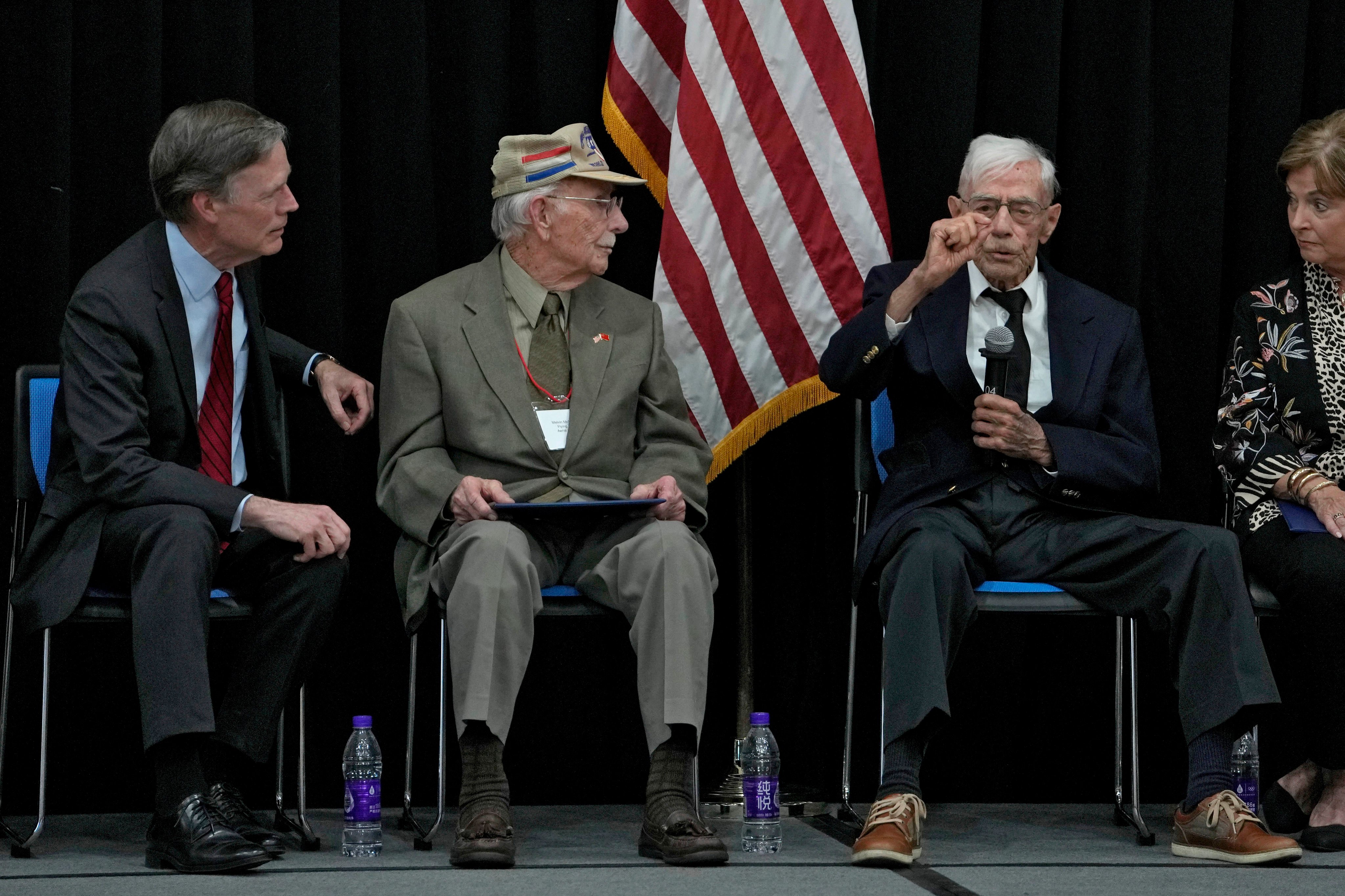 US World War II veteran Harry Moyer (second right) speaks next to his compatriot Mel McMullen (second left) and US ambassador to China Nicholas Burns, (left) during a ceremony in honour of Flying Tigers and their descendants held at the US Embassy in Beijing on Monday. Photo: AP