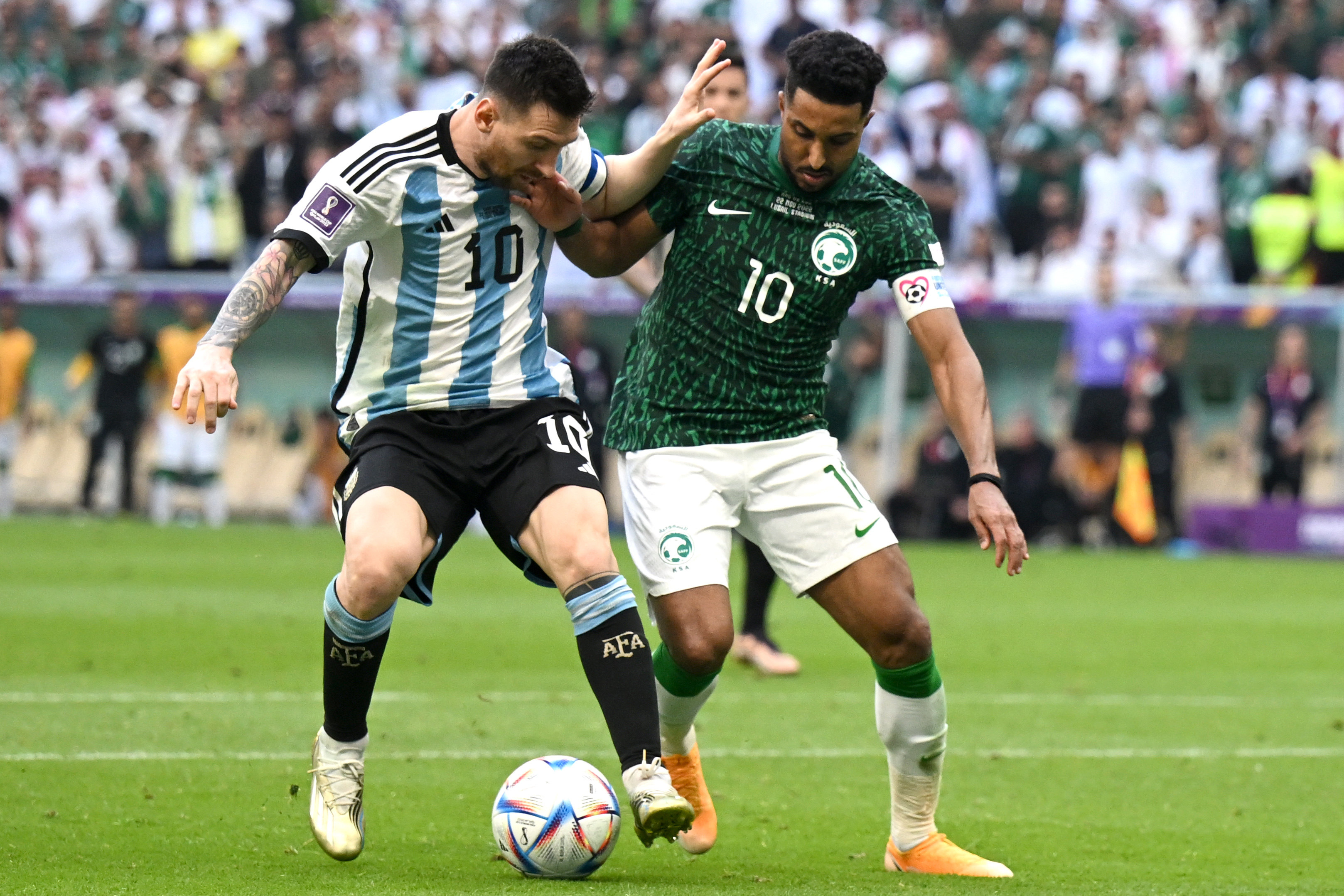 Saudi Arabia’s Salem Aldawsari (right) and Argentina’s Lionel Messi battle for the ball during the 2022 Fifa World Cup in Qatar. Photo: DPA