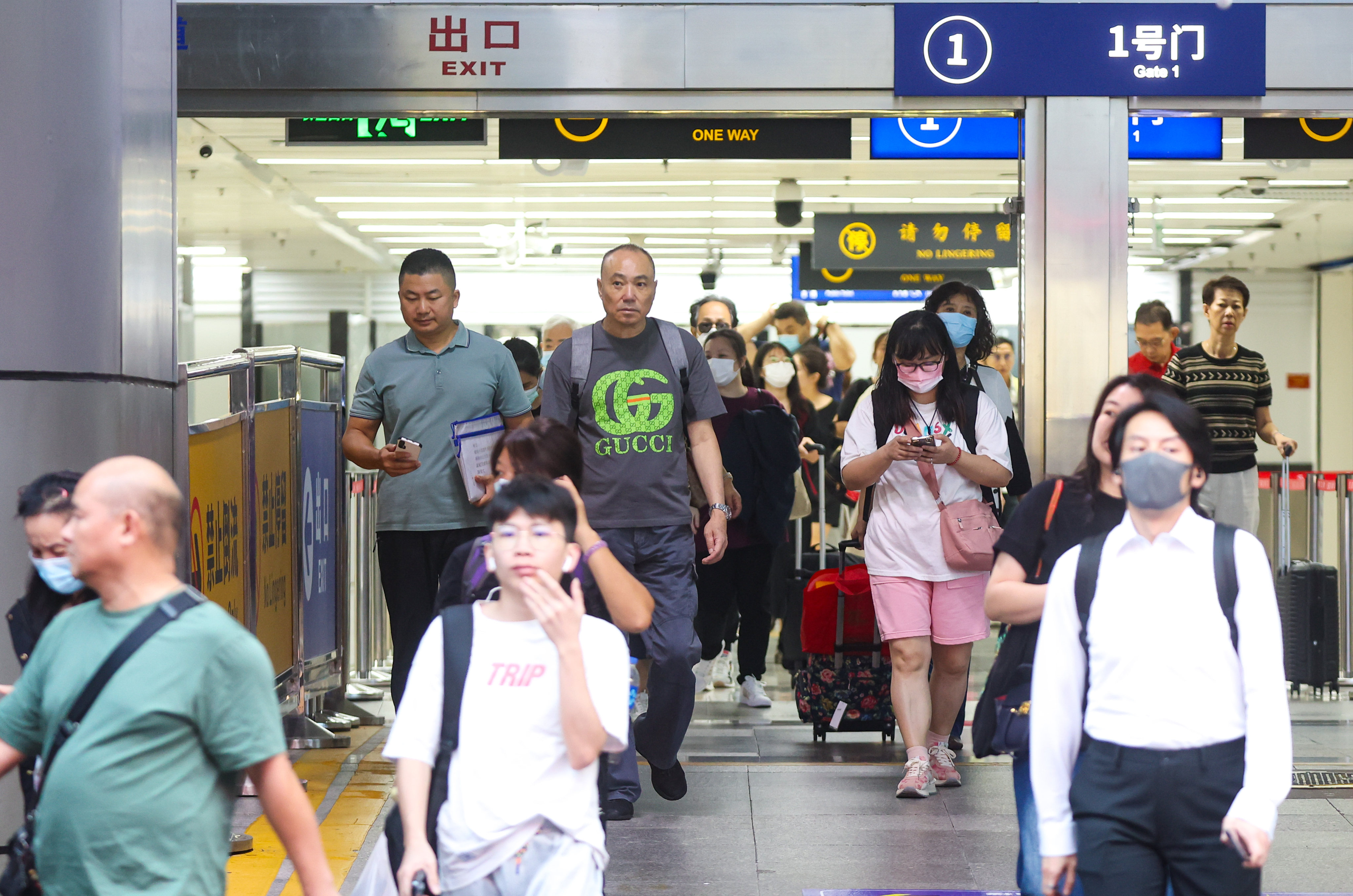 Travellers arrive in Shenzhen from Hong Kong after passing through the Lo Wu checkpoint. Photo: Edmond So