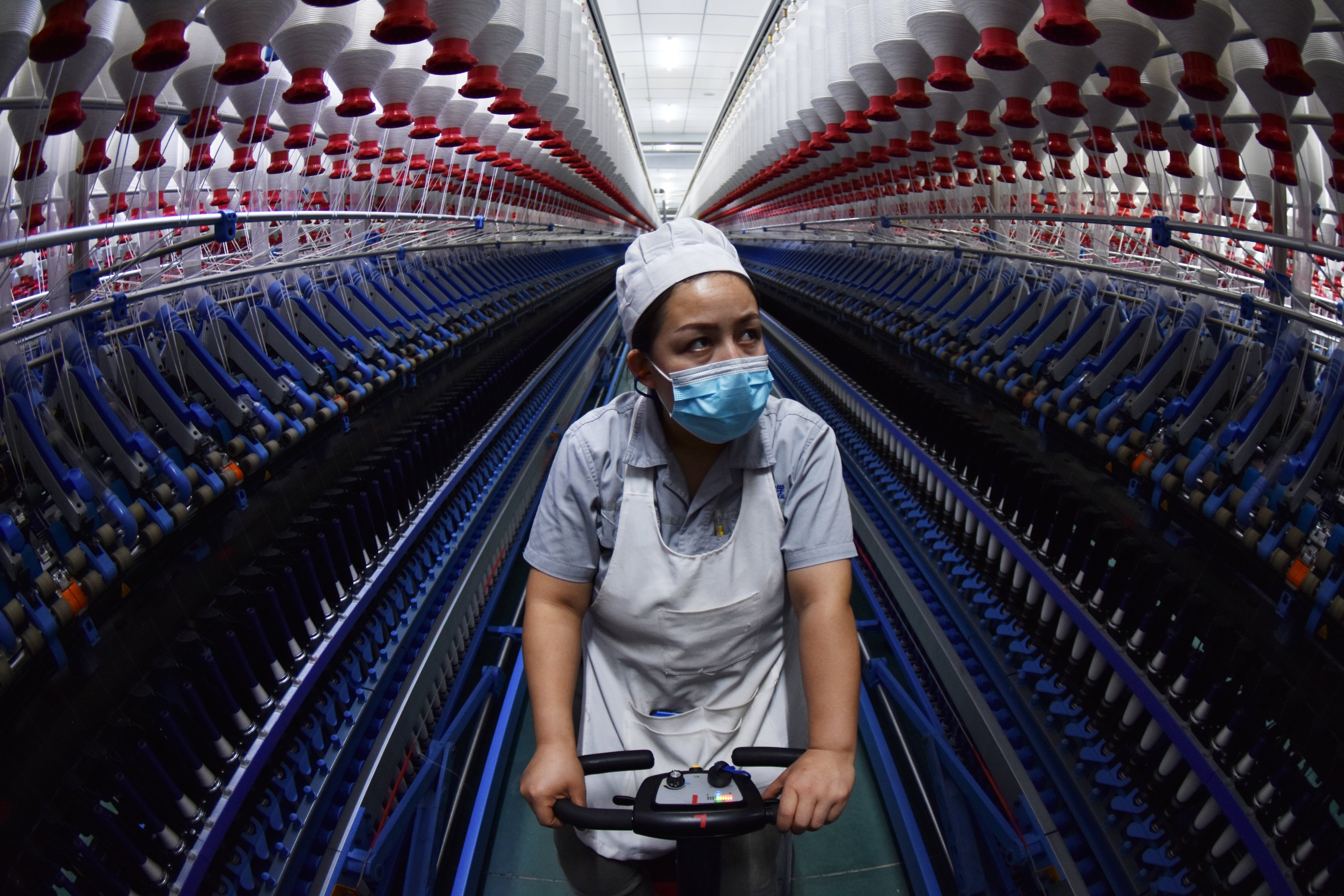 A textile-factory employee in Xinjiang, where China is looking to boost innovation in manufacturing. Photo: Getty Images