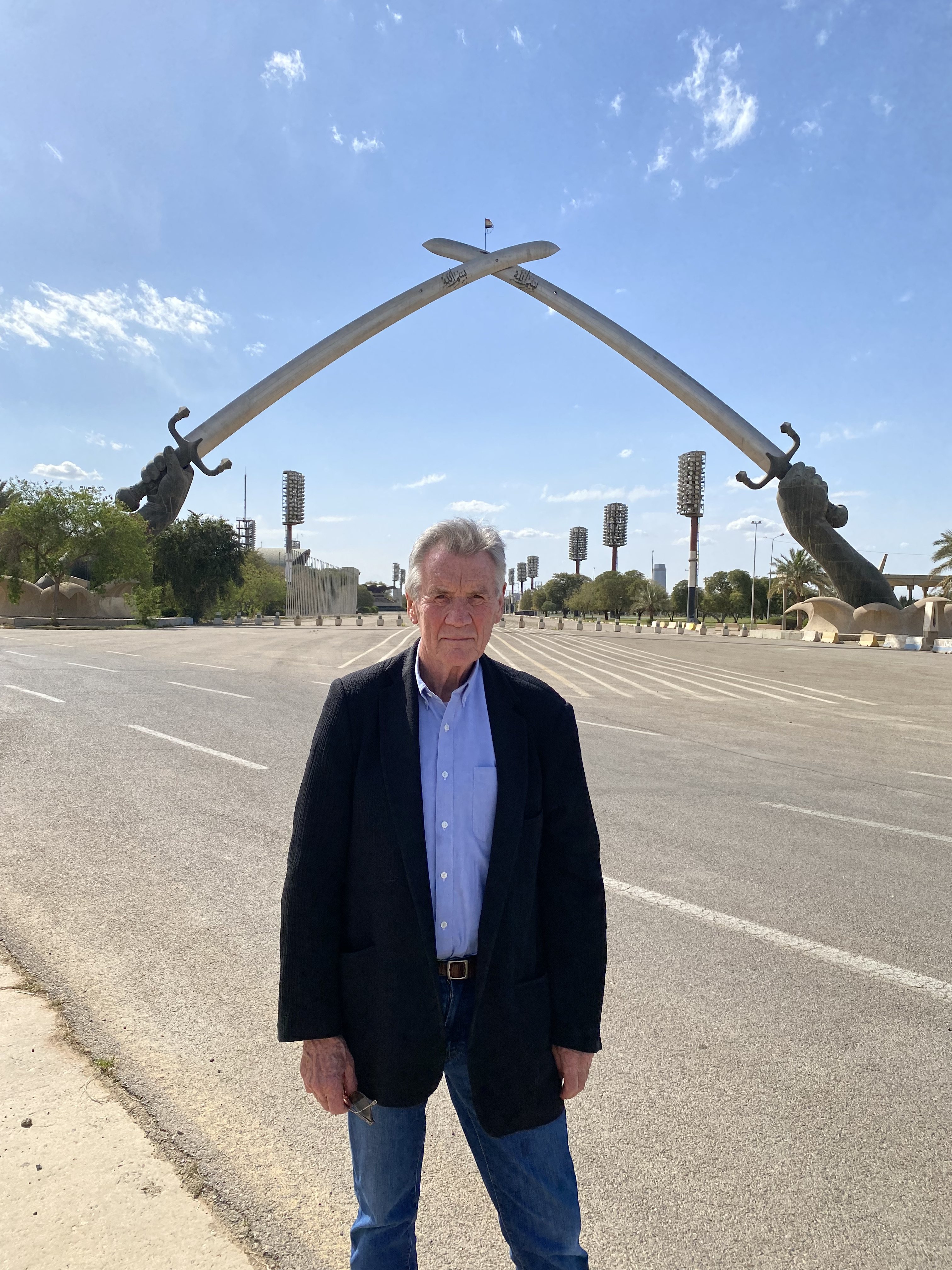 Michael Palin in front of the Victory Arch in Baghdad, Iraq in a still from BBC Earth’s “Michael Palin into Iraq”. Photo: ITN Productions/Doug Dreger