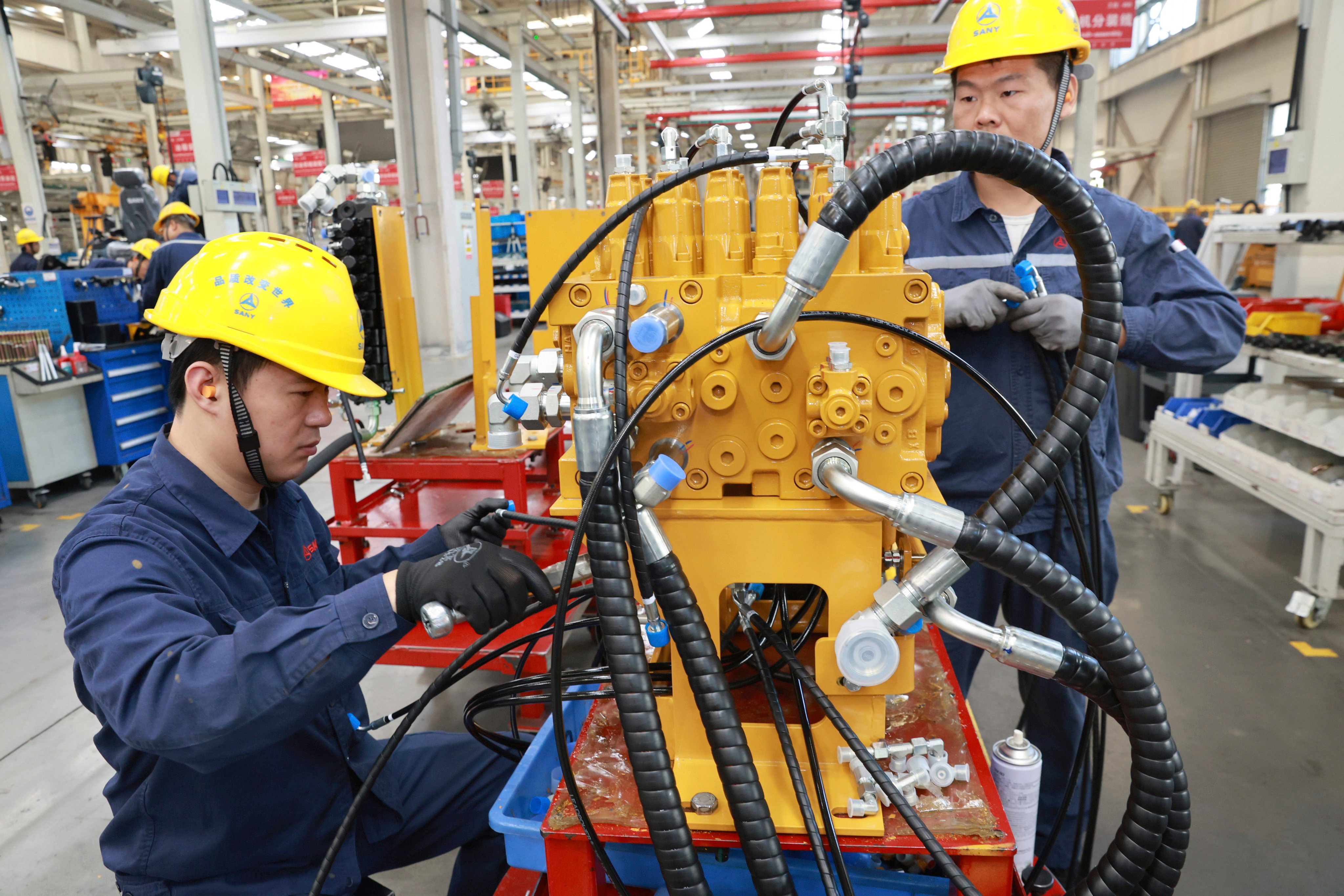 Both China’s official manufacturing purchasing managers’ index (PMI) and the Caixin/S&P Global manufacturing PMI both fell into contraction in October. Photo: Chinatopix via AP