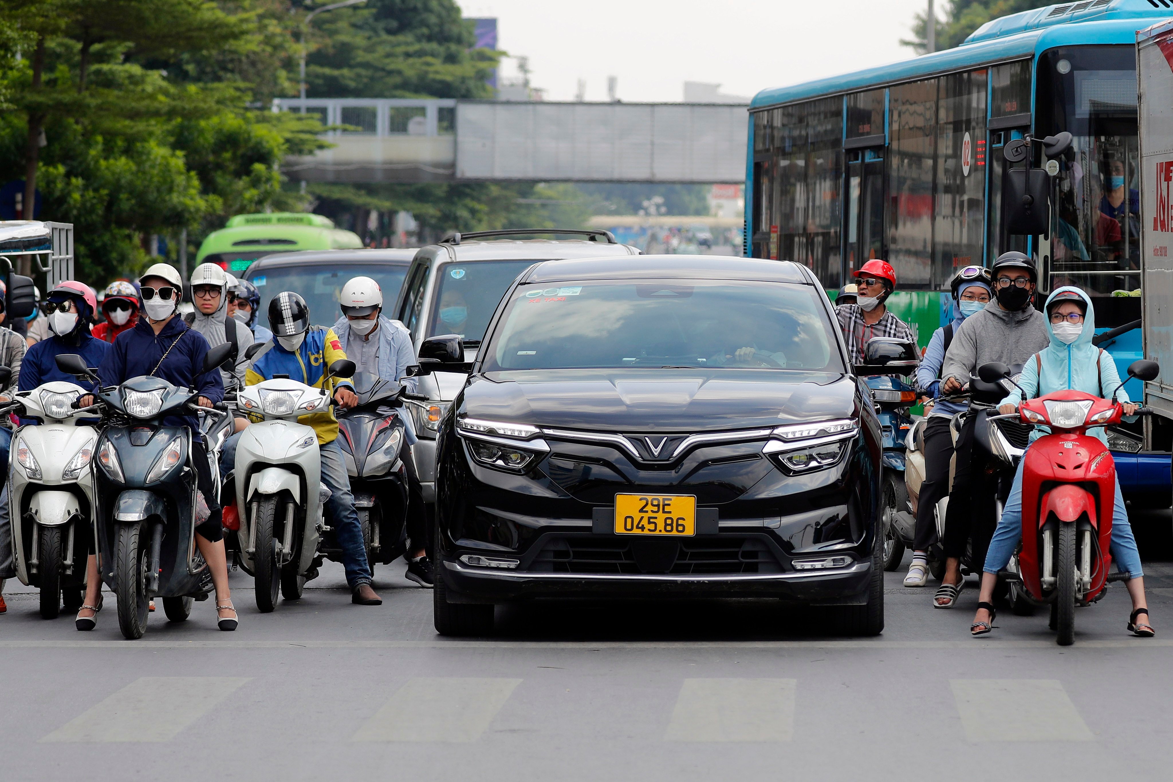 A Vinfast electric car is seen on a Hanoi street in August. Analysts say Vietnam is an outlier in Southeast Asia’s EV race, with less of a focus on attracting foreign direct investment and more on building up domestic brands. Photo: EPA-EFE