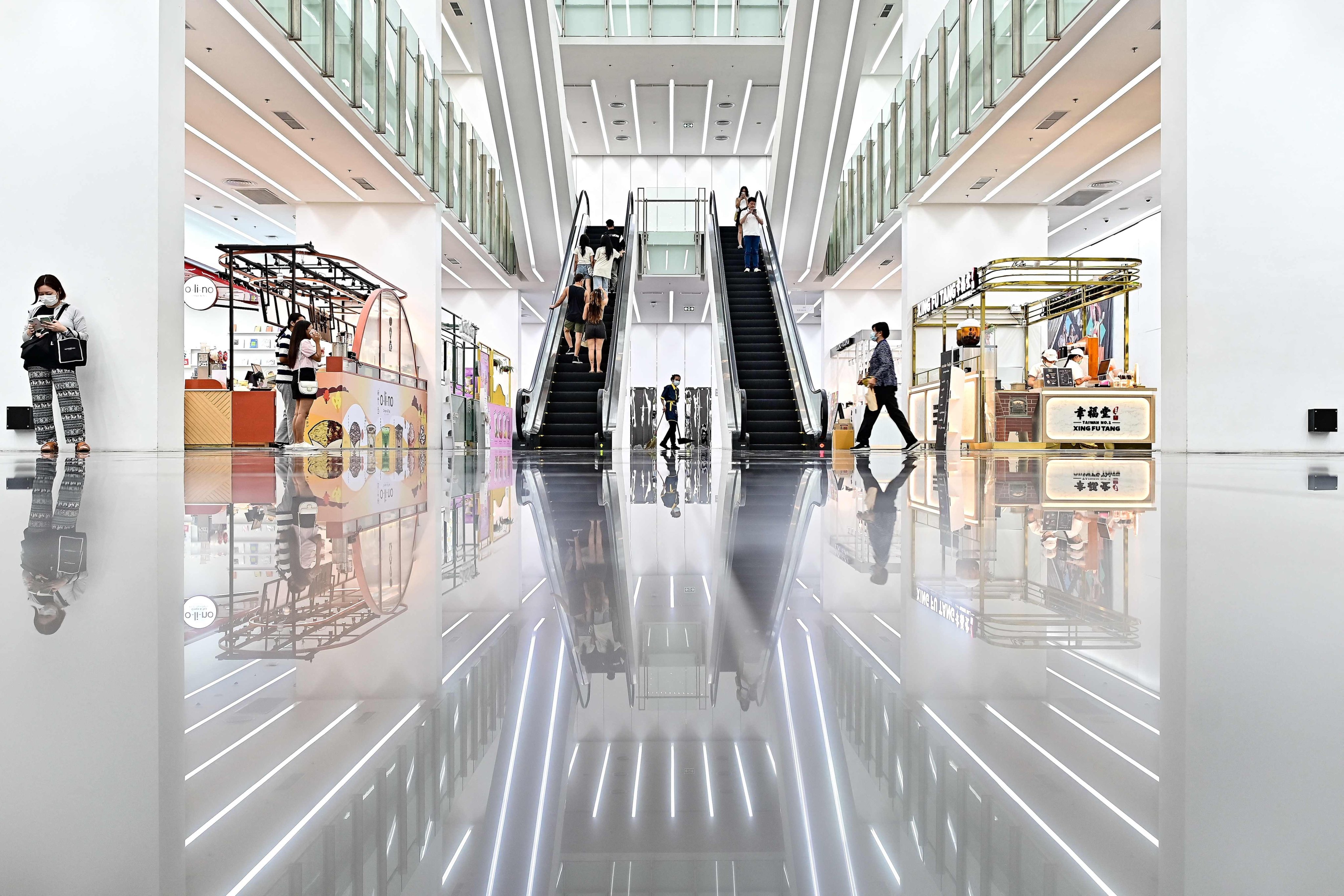 People walk inside a near-empty shopping centre in Bangkok last month. Thailand could face prolonged challenges from weak growth and stagnating demand in Northeast Asia. Photo: AFP