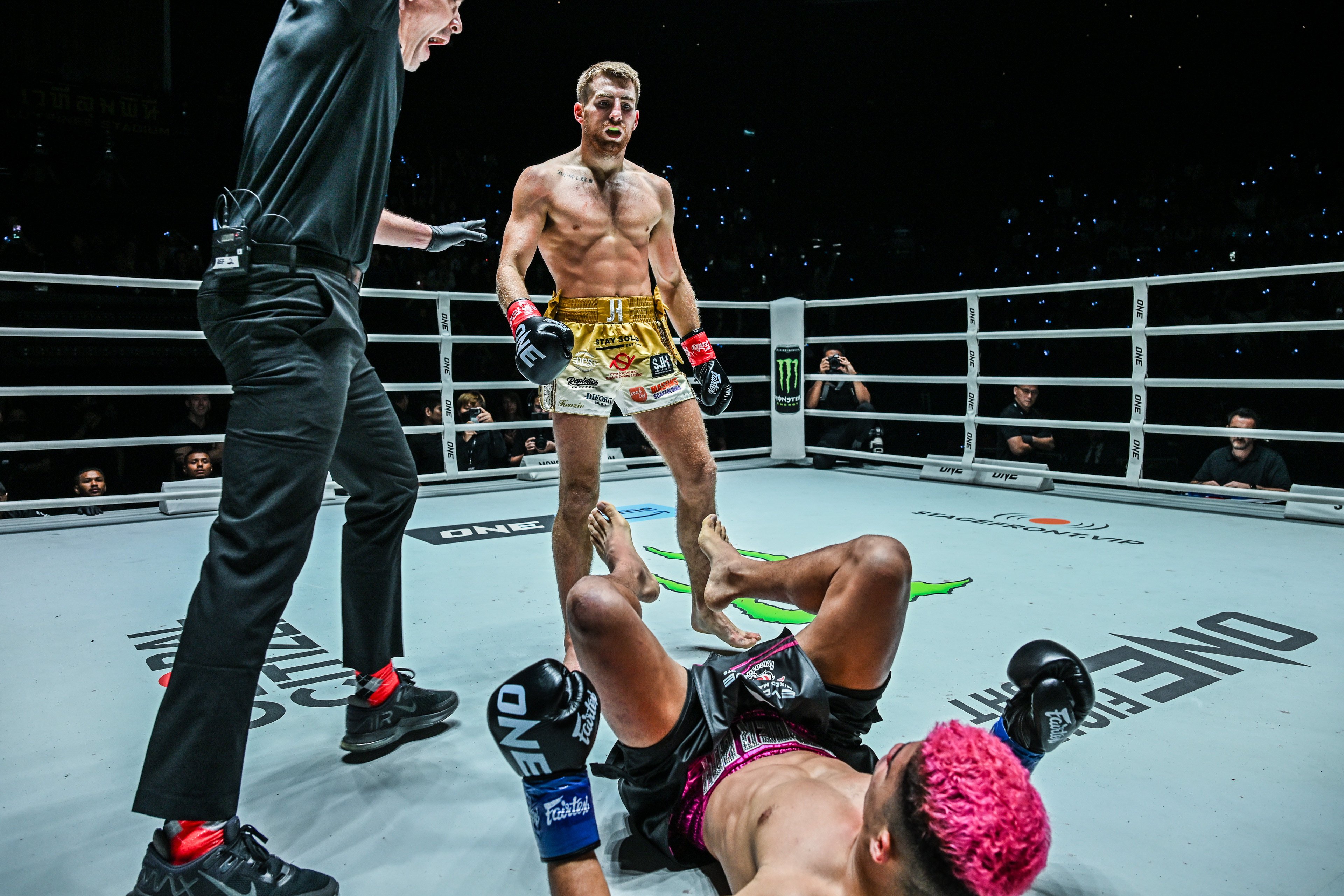 Jonathan Haggerty knocks down Fabricio Andrade to become a two-sport champion at ONE Fight Night 16. Photo: ONE Championship
