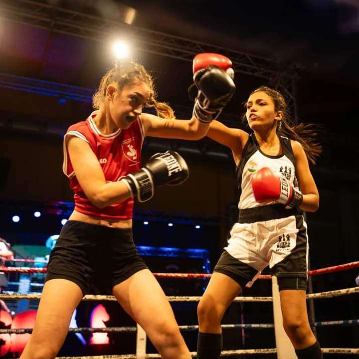 Kenza Megzari (left) blocks a punch from India’s Sneha Waykar during their match at the World Chessboxing Championships in Italy. Photo: Handout