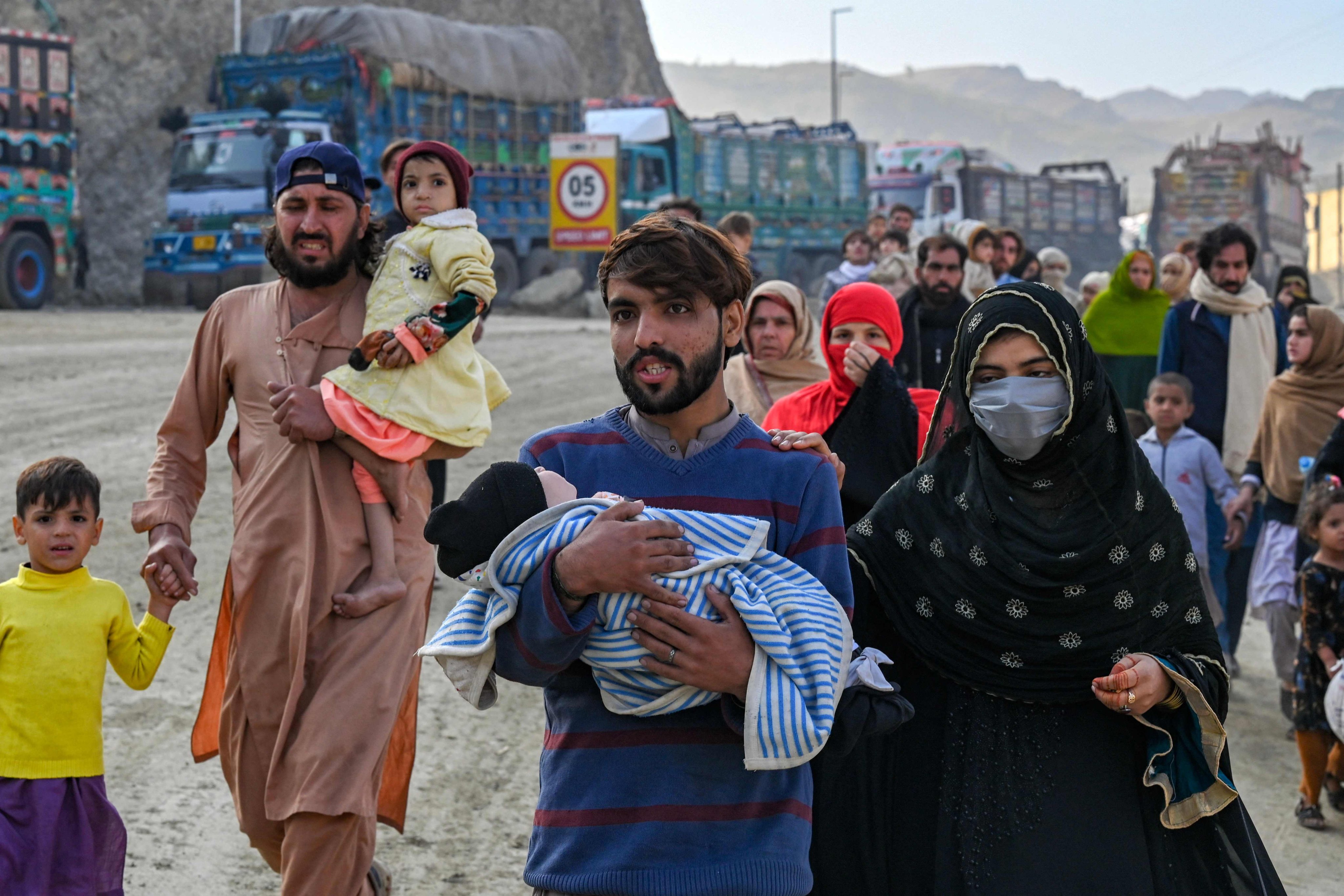Afghan refugees in Pakistan walk towards the Pakistan-Afghanistan Torkham border on Friday. Photo: AFP