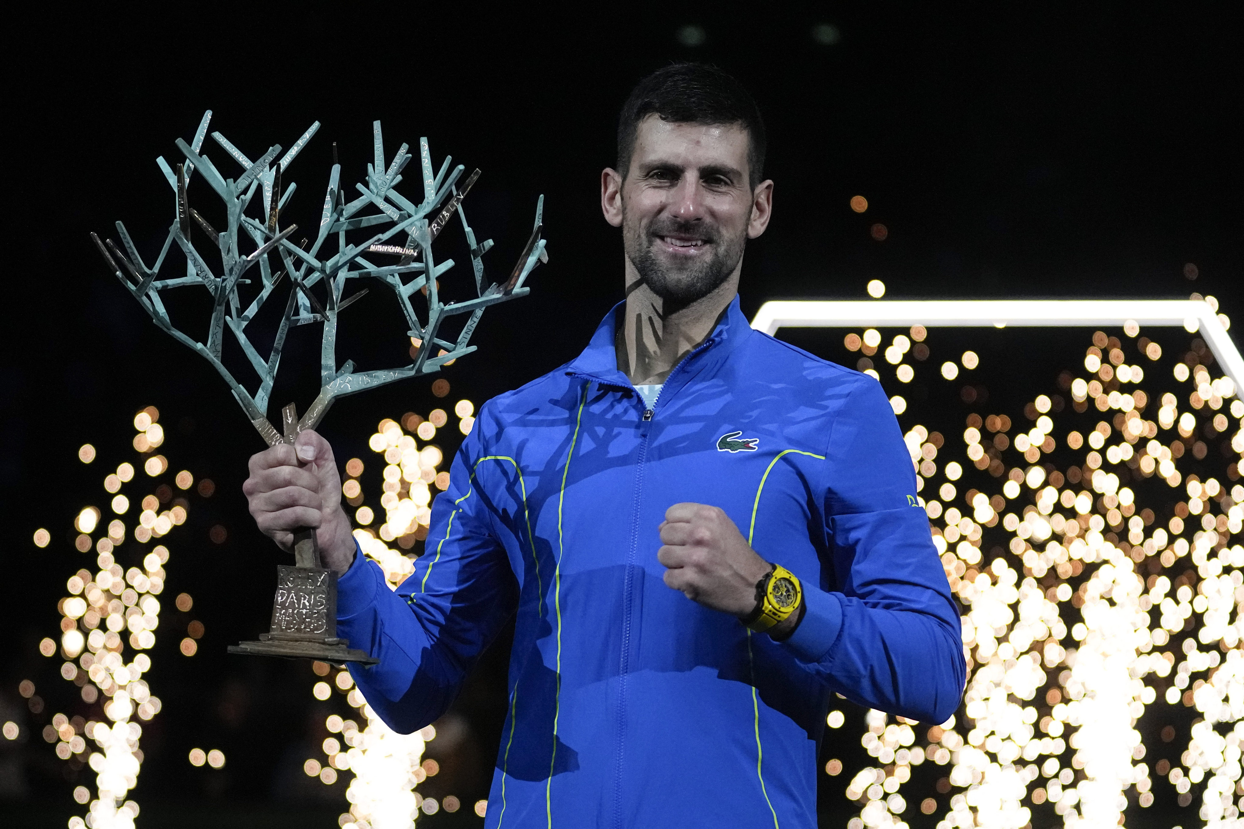 Serbia’s Novak Djokovic shows off his the trophy after winning the Paris Masters final. Photo: AP