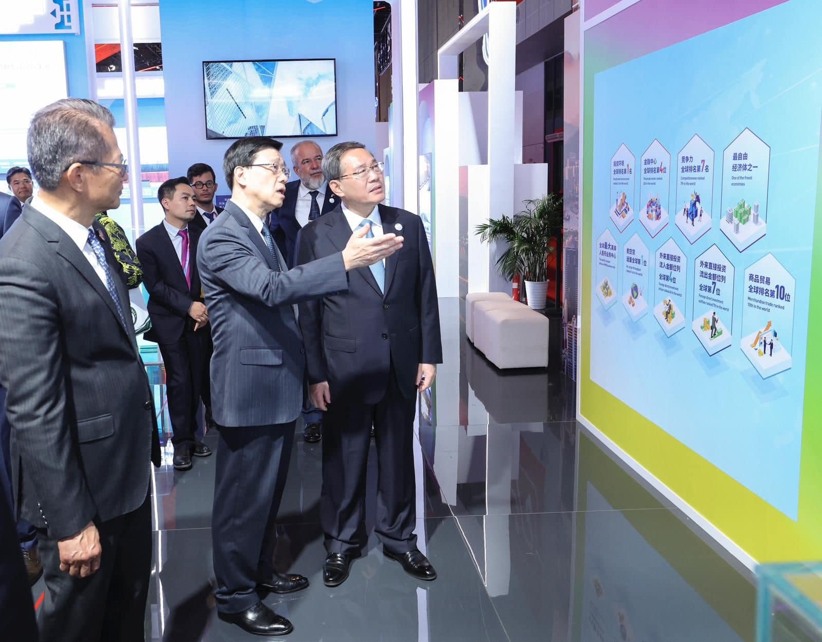 Chief Executive John Lee (centre) tours the expo’s Hong Kong exhibition area with Premier Li Qiang. Photo: Handout 