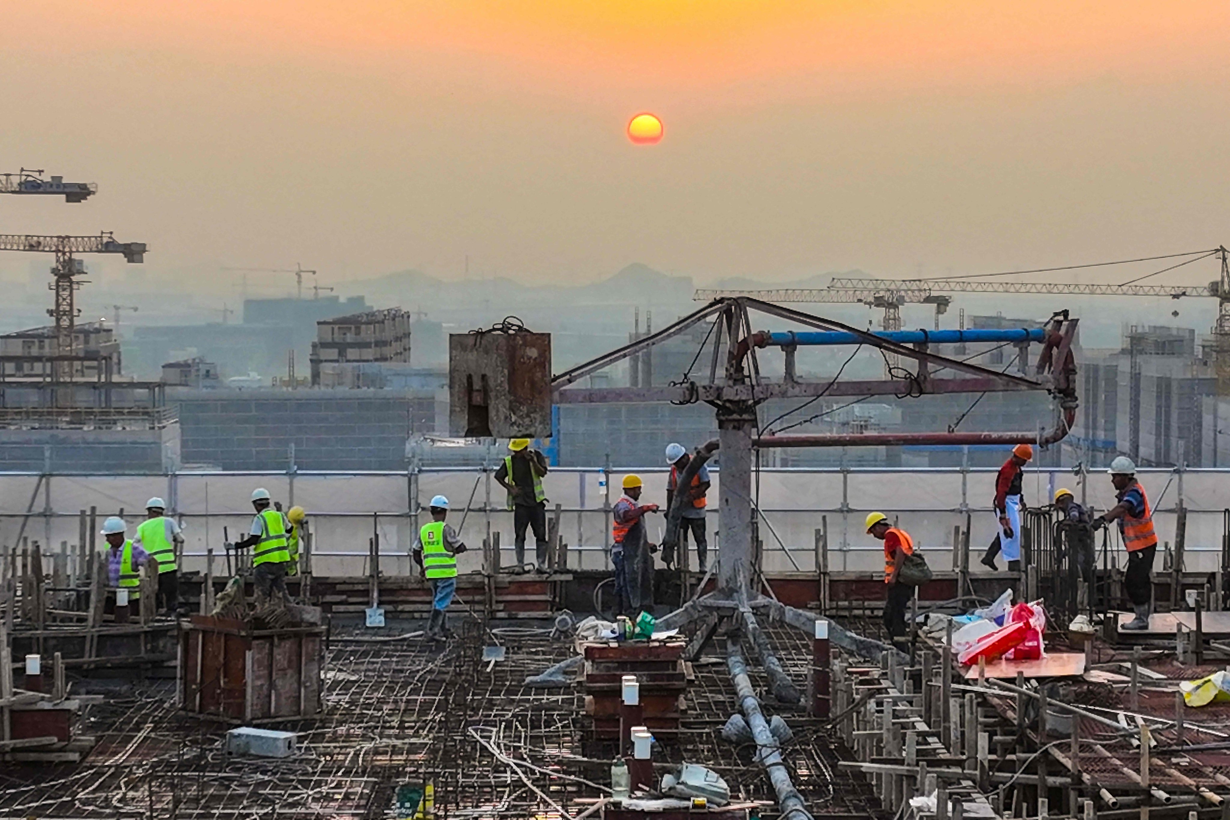 Workers are seen at a housing project construction site in Ningbo, in China’s Zhejiang province, on September 17. The persistent issues in China’s property sector call for for bold reforms from the central government in the face of global headwinds and resistance from interest groups. Photo: AFP 