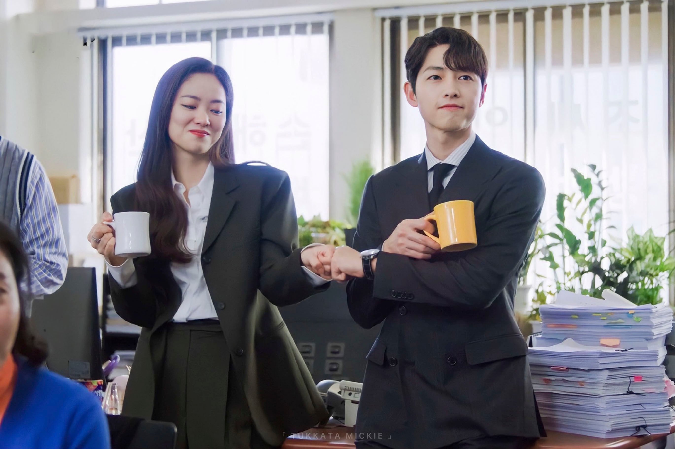 Song Joong-ki (right) and Jeon Yeo-been drink coffee in a still from K-drama series Vincenzo. Photo: courtesy of tvN