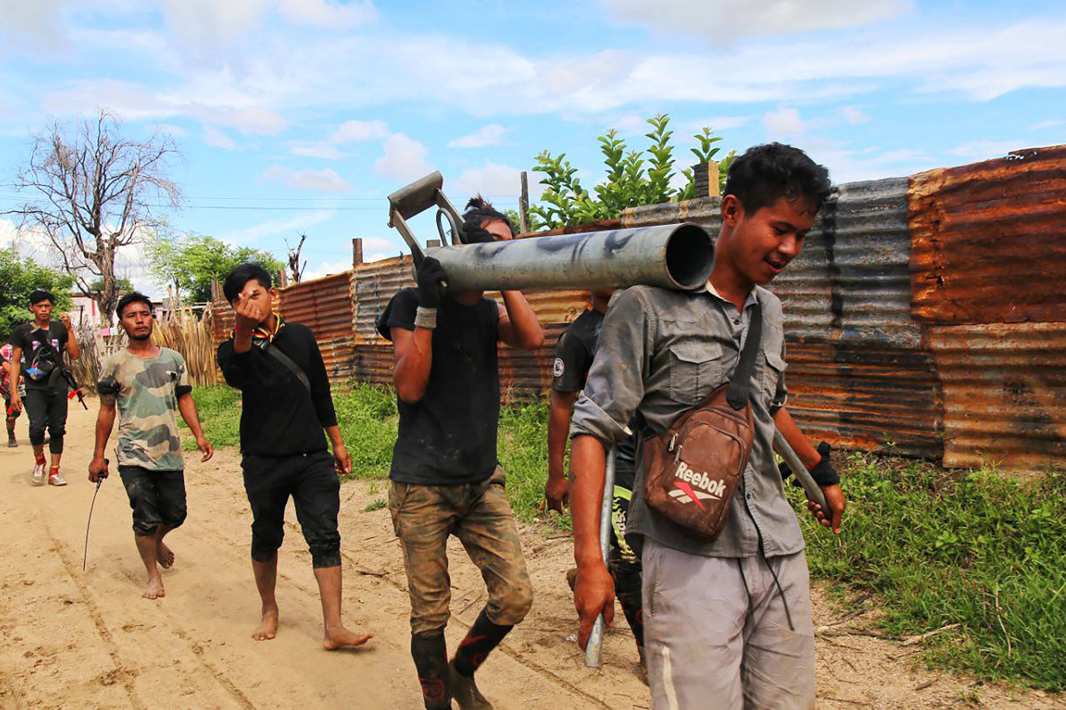 Anti-coup fighters walking with weapons in a township in Myanmar’s northwestern Sagaing region in August last year. A resident interviewed by phone said resistance fighters had taken control of the whole of Kawlin town in Sagaing as of Monday. Photo: AFP
