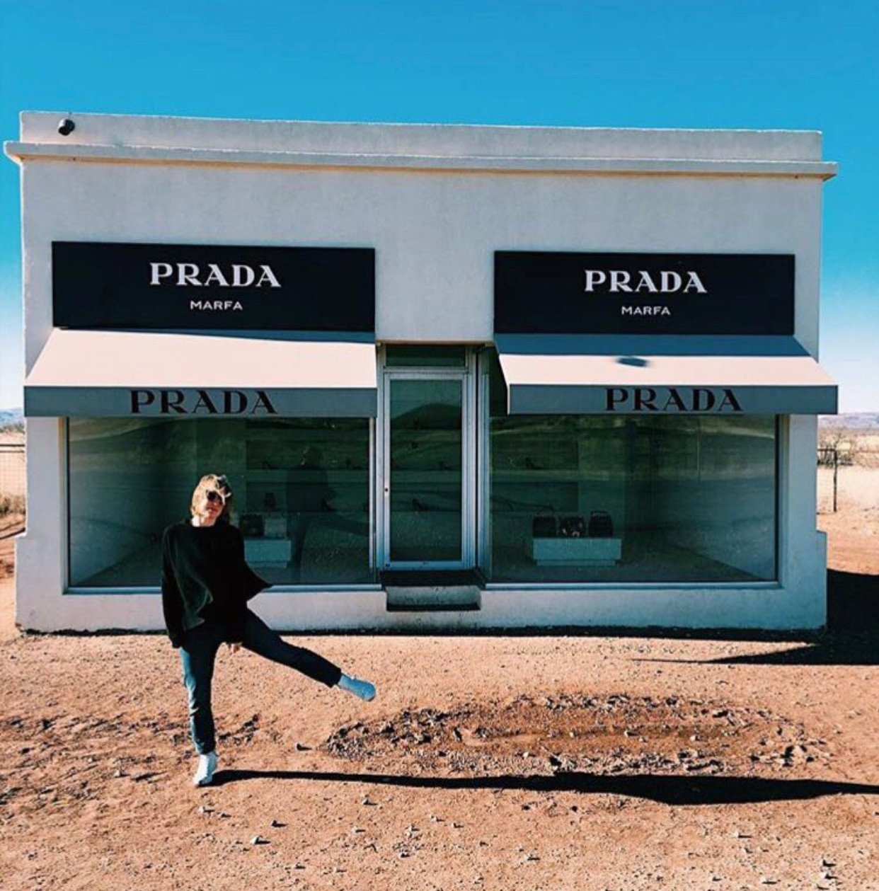 Kate Jones, founder of creative agency At Liberty and eco-friendly online gift retailer Get.Give, poses outside “Prada Marfa”, a permanent sculptural art installation in the town of Marfa, in the US state of Texas. Photo: Kate Jones