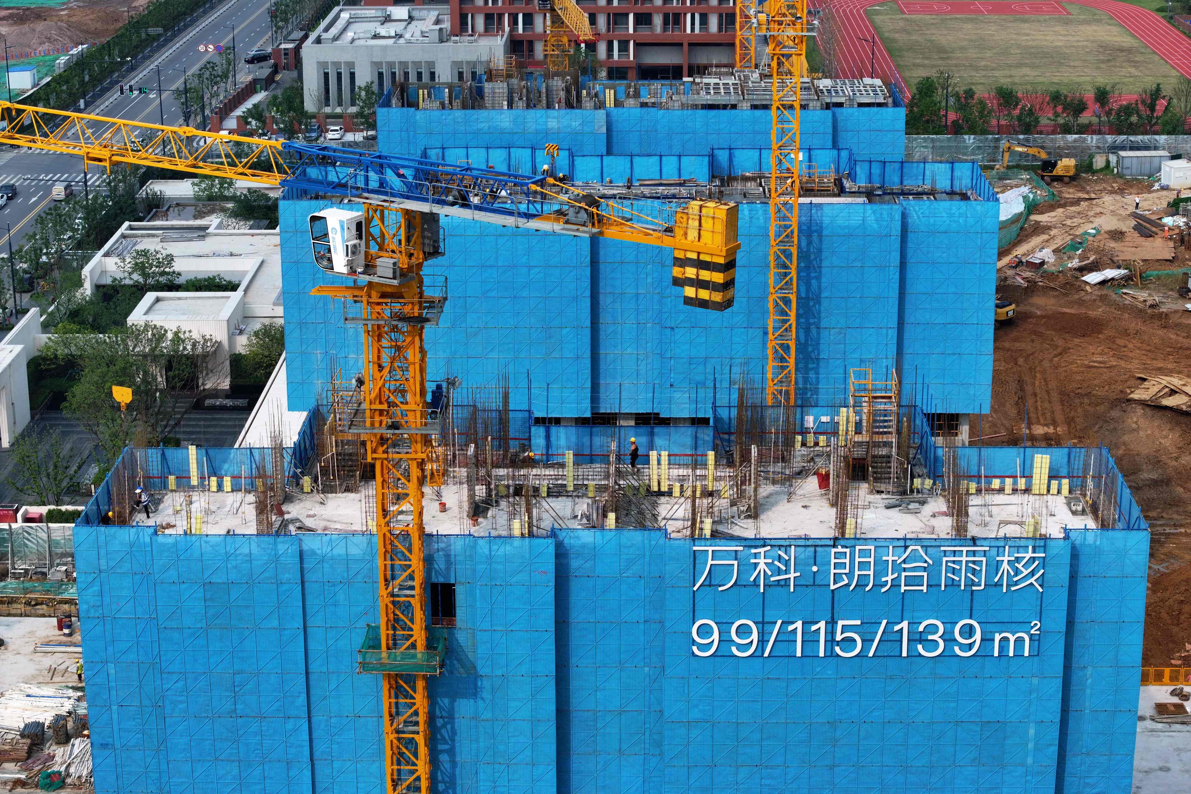 This aerial photo taken on October 9, 2023 shows residential buildings under construction by Chinese real estate developer Vanke in Nanjing, in China’s eastern Jiangsu province. Photo: AFP