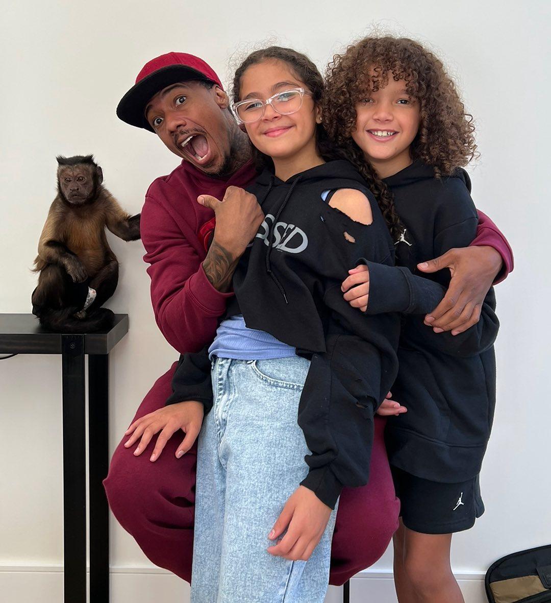 Nick Cannon with his eldest children, twins Monroe (centre) and Moroccan. Photo: @nickcannon/Instagram