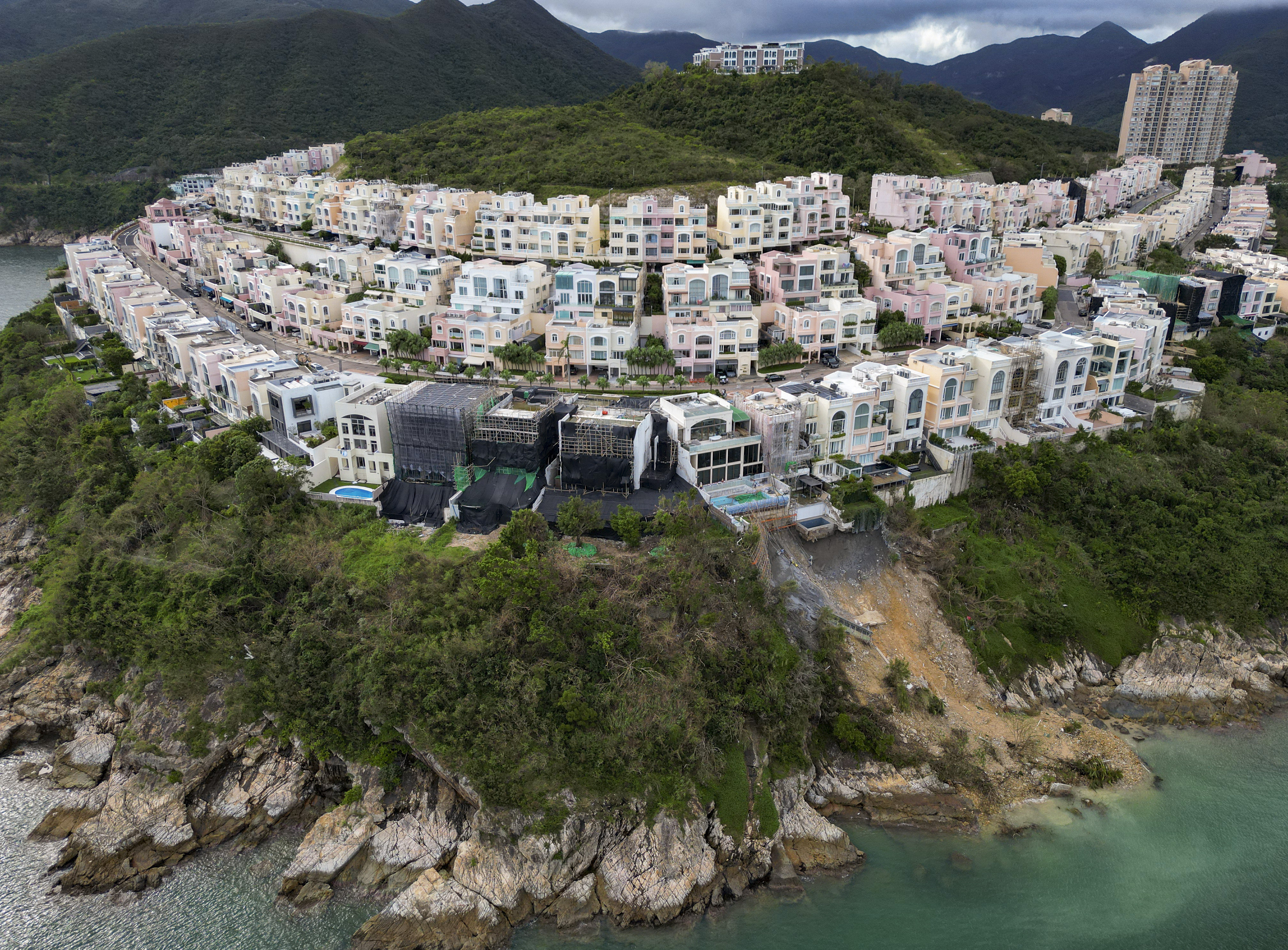 Damage from a landslide is seen at the Redhill Peninsula. Inspections of the houses there have uncovered many cases of Illegal structures or occupation of government land without permission. At least four owners have been slapped with removal orders. Photo: Sam Tsang
