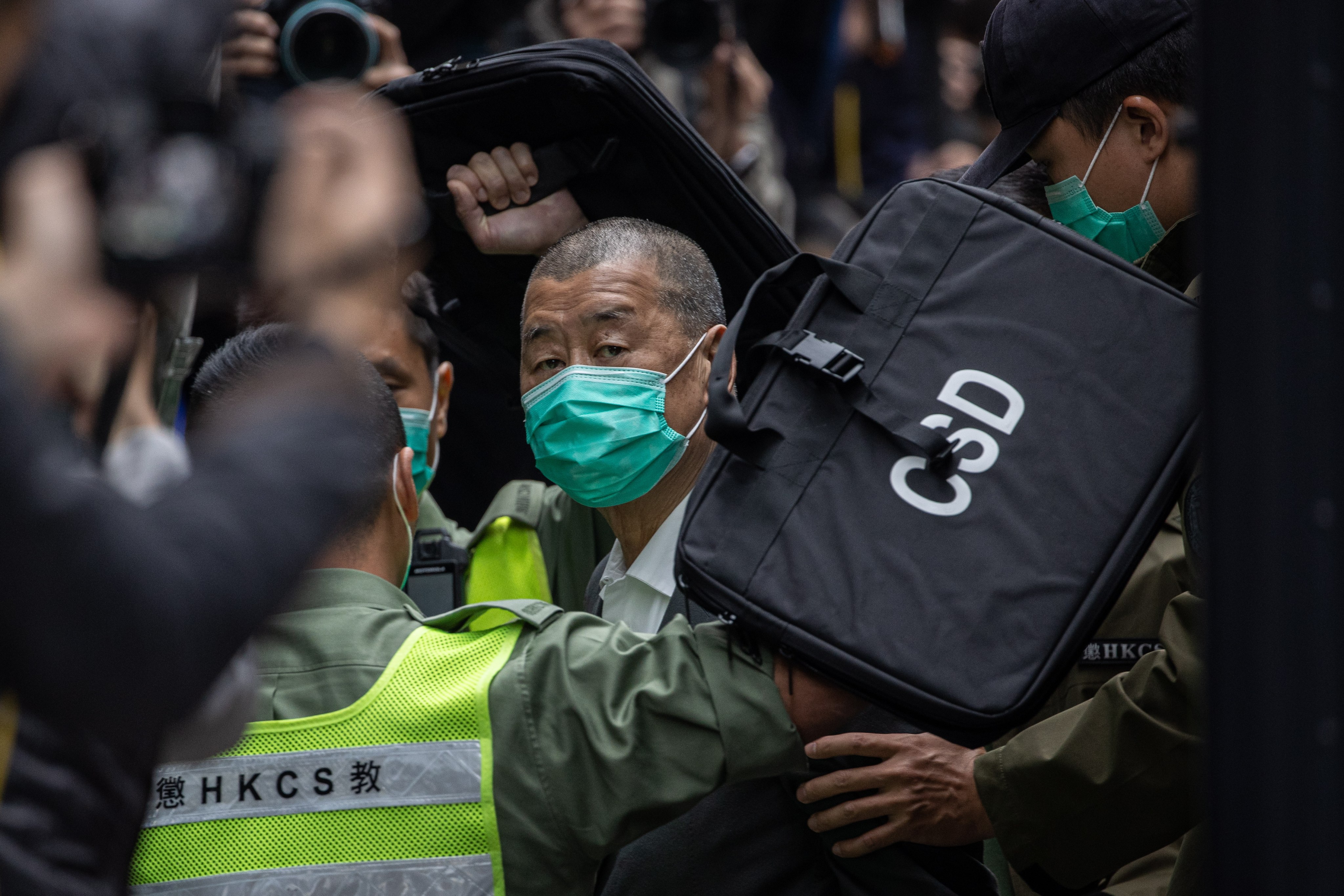 Media mogul Jimmy Lai Chee-ying (centre), seen escorted into the Court of Final Appeal in Hong Kong on Feb. 9, 2021, is among those named in the Congressional-Executive Commission on China’s letter. Photo: EPA-EFE