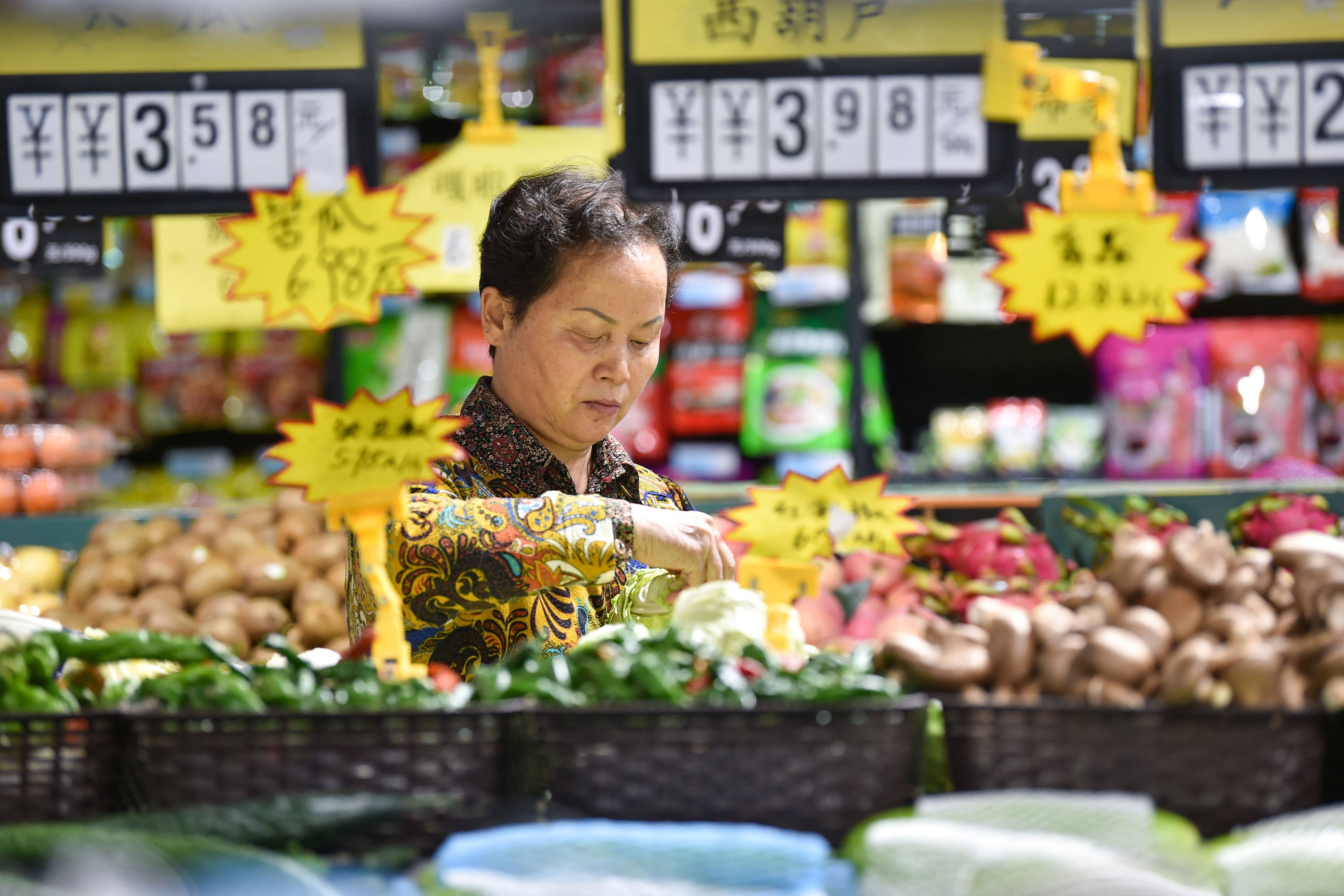 A customer shops at a supermarket in Nanjing, in China’s eastern Jiangsu province on October 13, 2023. Photo: AFP