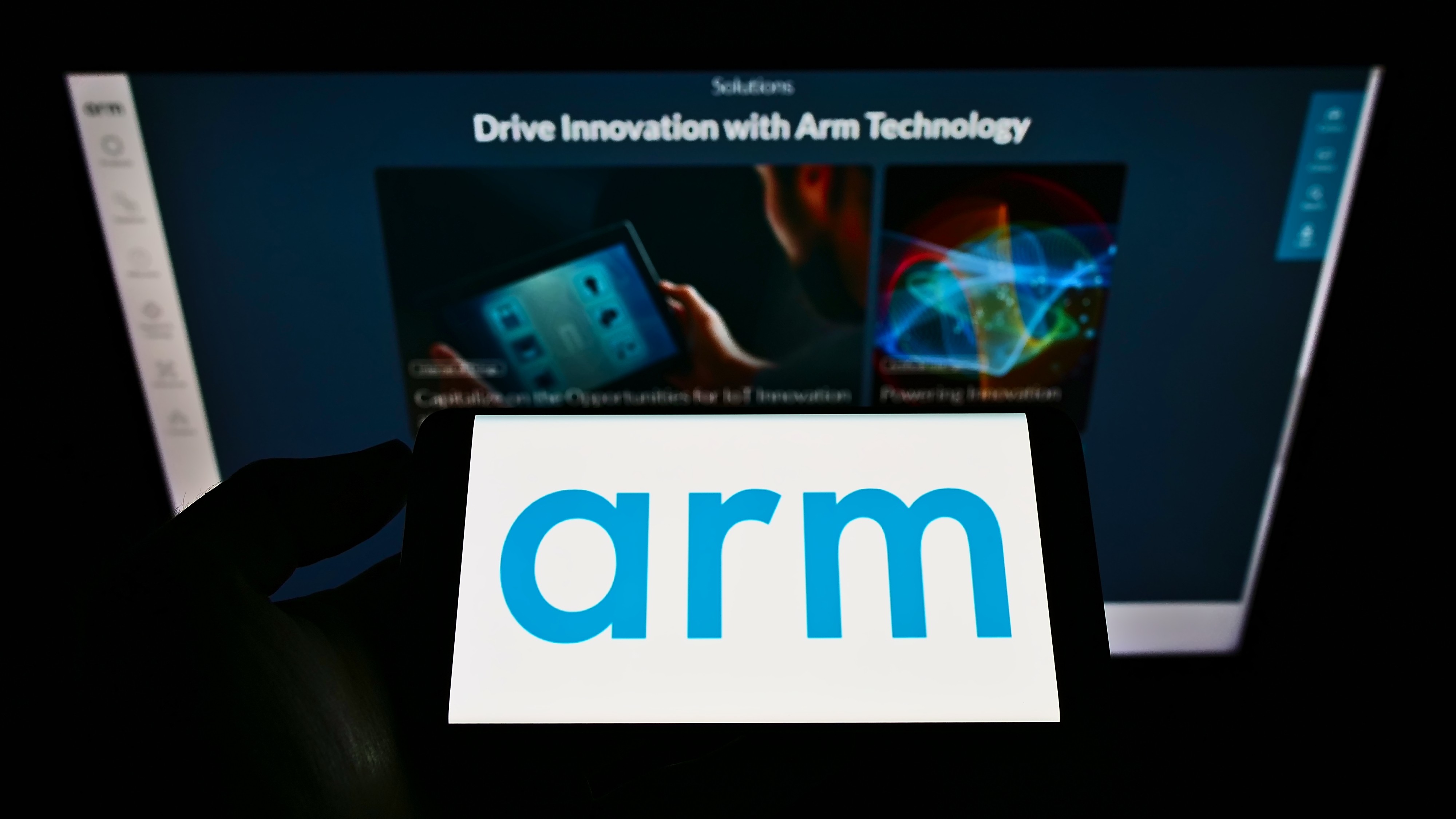 The logo of Arm seen on a screen in front of a business webpage. Photo: Shutterstock
