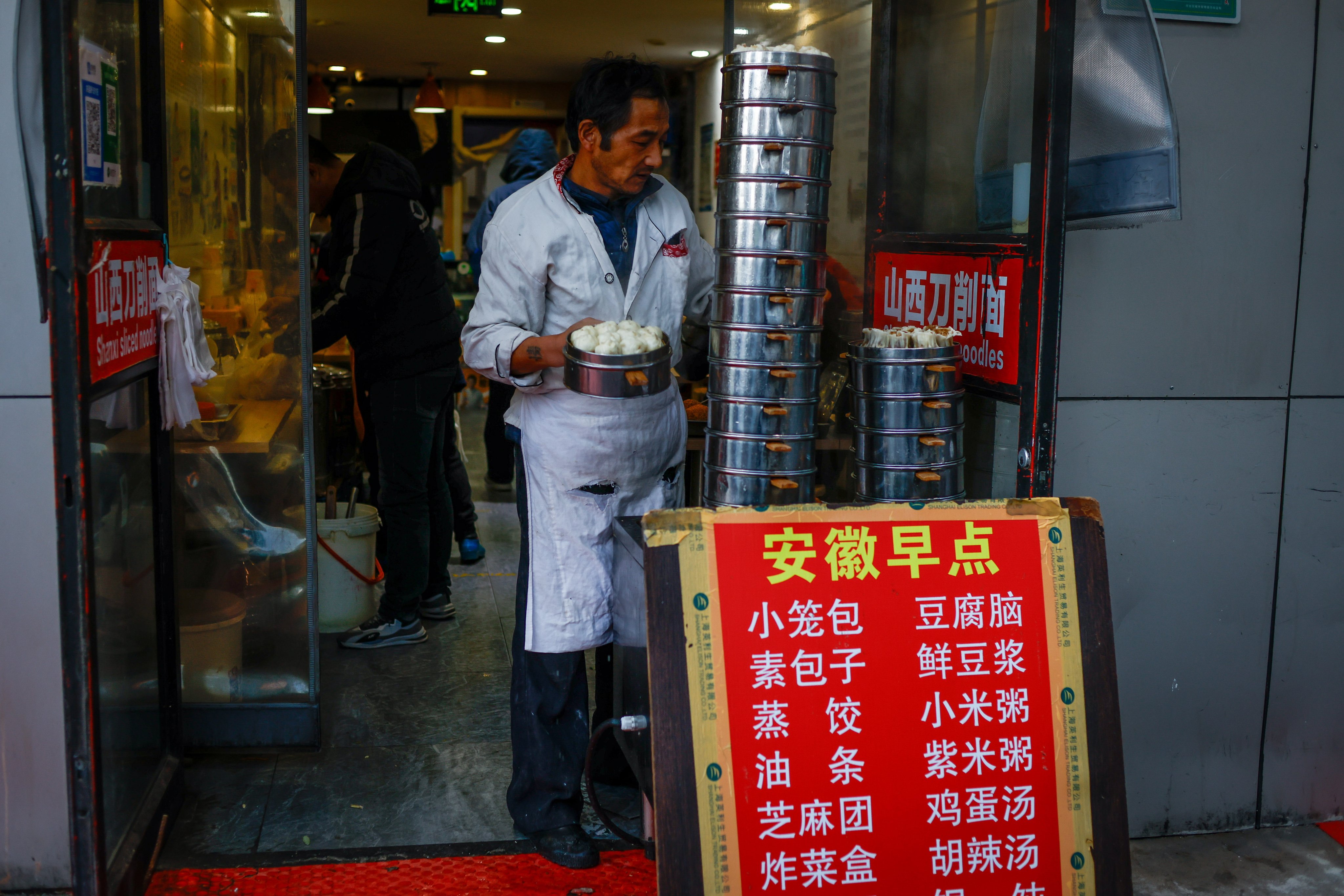 China’s economy grew by 1.3 per cent in the third quarter from the previous three months, and by 4.9 per cent year on year. Photo: EPA-EFE