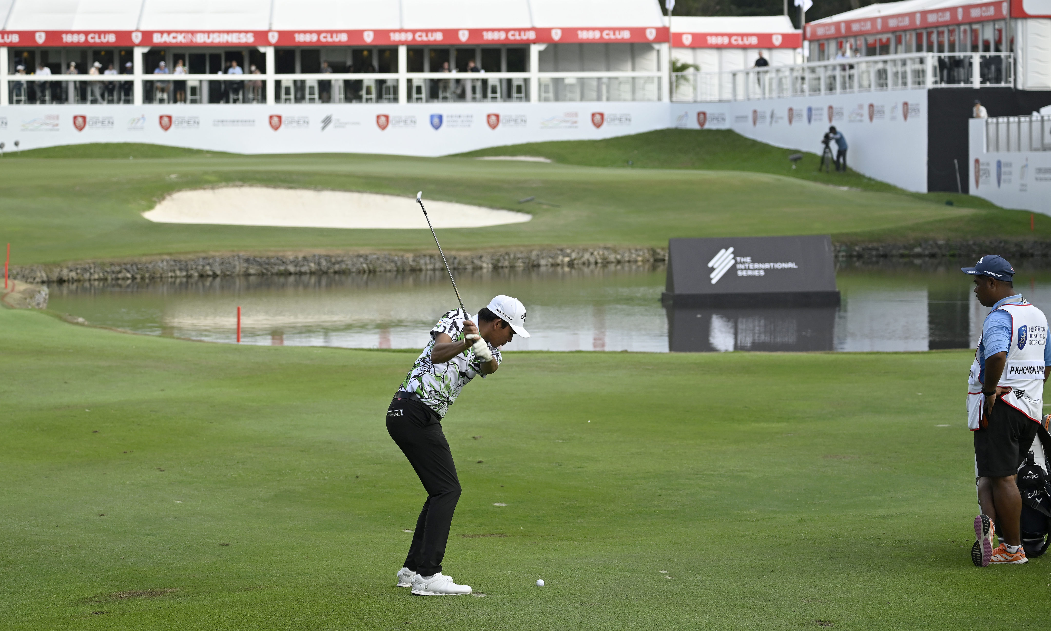 Phachara Khongwatmai hits his approach into the 18th green during the second round of the Hong Kong Open. Photo: Asian Tour.