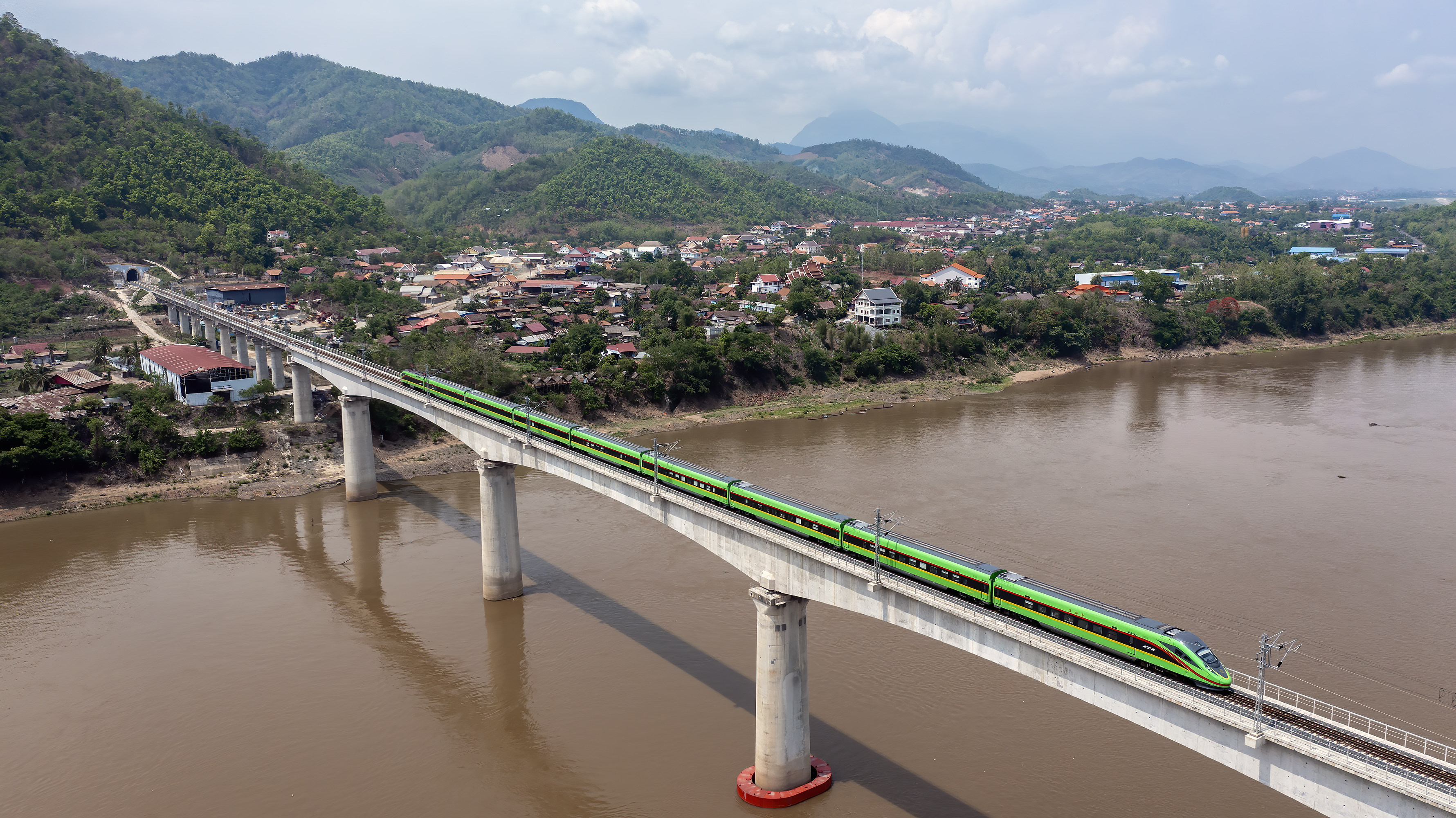 A train on the China-Laos railway crosses a bridge over the Mekong River in Laos on May 28. Difficult terrain, geopolitical uncertainty and a lack of connectivity are just some of the hurdles to securing investment in Southeast Asian countries’ railway networks. Photo: Xinhua