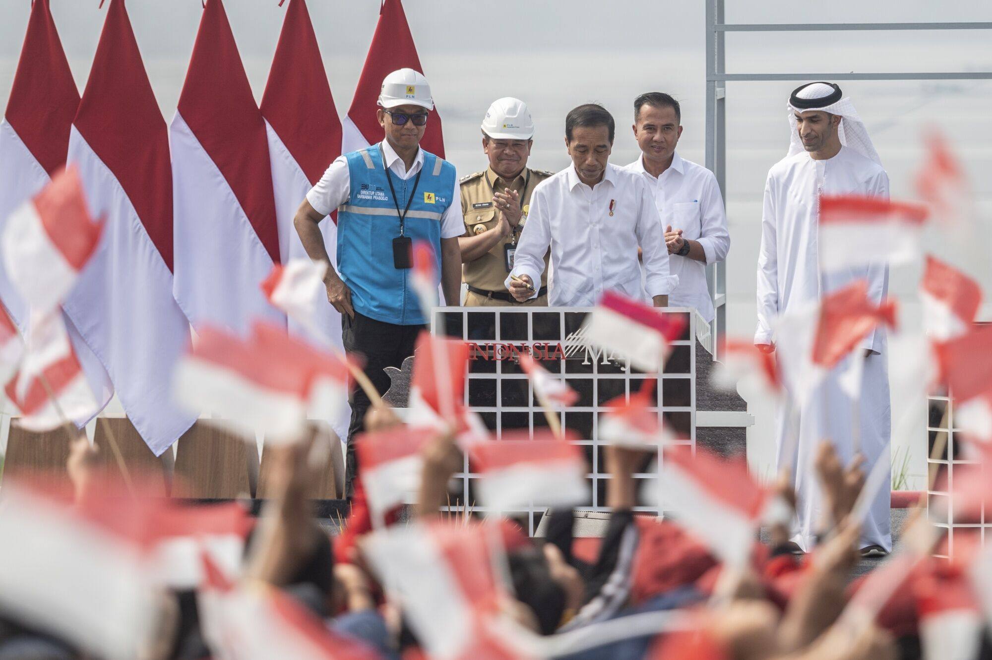 President Joko Widodo (middle) attends the inauguration ceremony of the Cirata Floating Photovoltaic Power Plant. Accelerating the energy transition has been a priority for the president, with Indonesia aiming for net zero emissions by 2060. Photo: Bloomberg