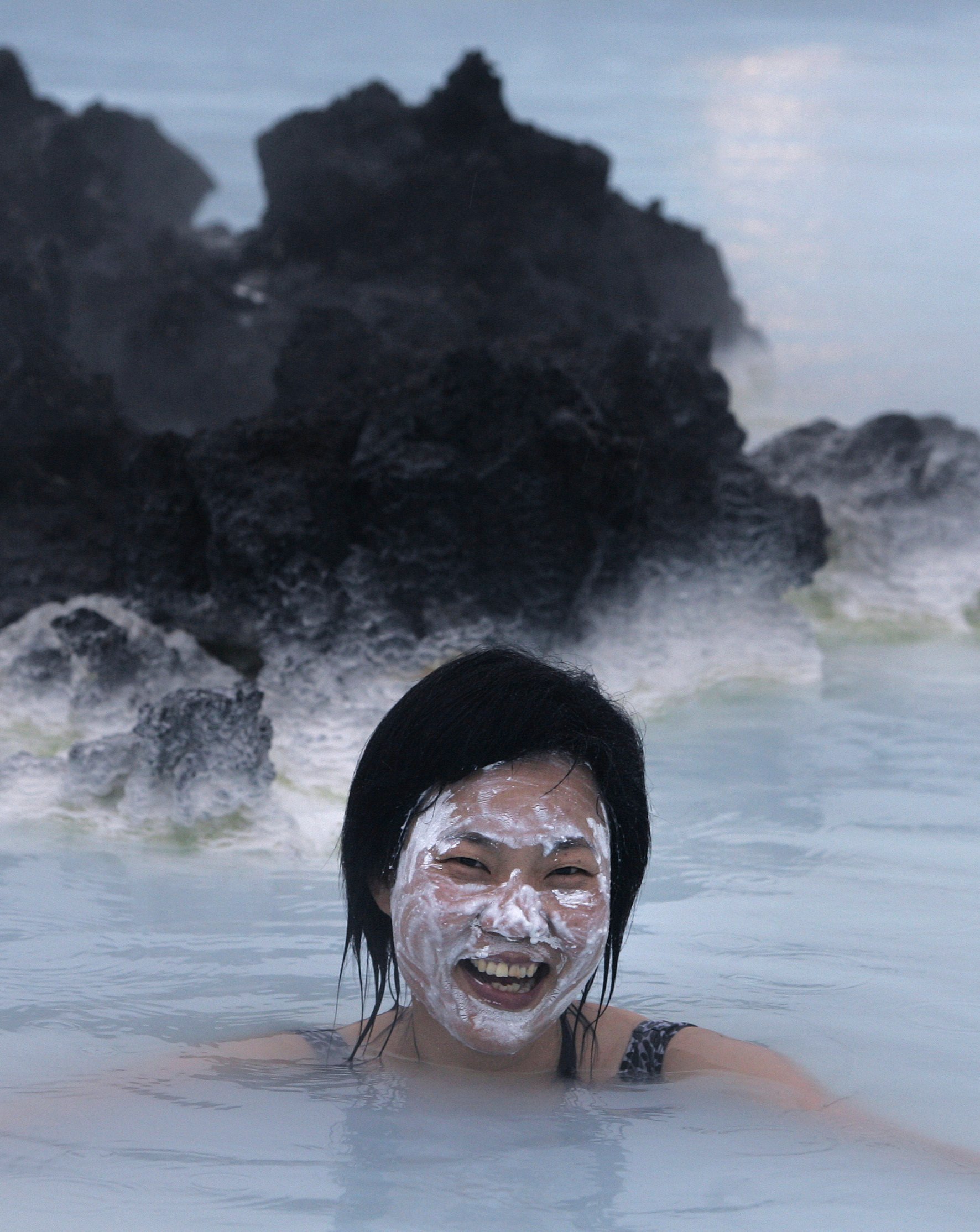A tourist at the Blue Lagoon geothermal spa in Iceland. The spa has temporarily closed after a series of earthquakes put Iceland’s southwestern corner on volcano alert. Photo: AP