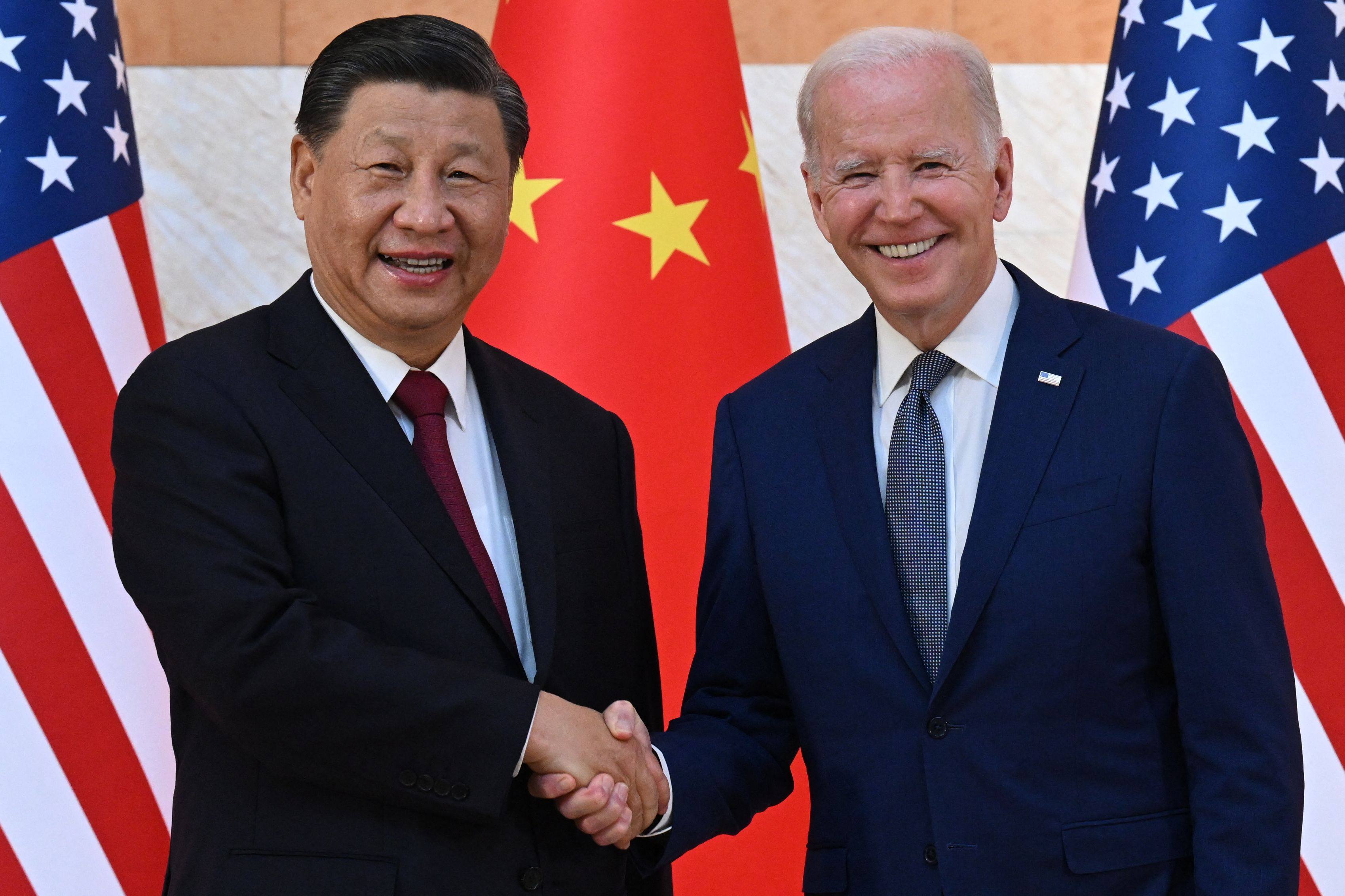 Chinese President Xi Jinping and US President Joe Biden shake hands on the sidelines of the Group of 20 Summit, in Nusa Dua on the Indonesian resort island of Bali, on November 14, 2022. Photo: AFP