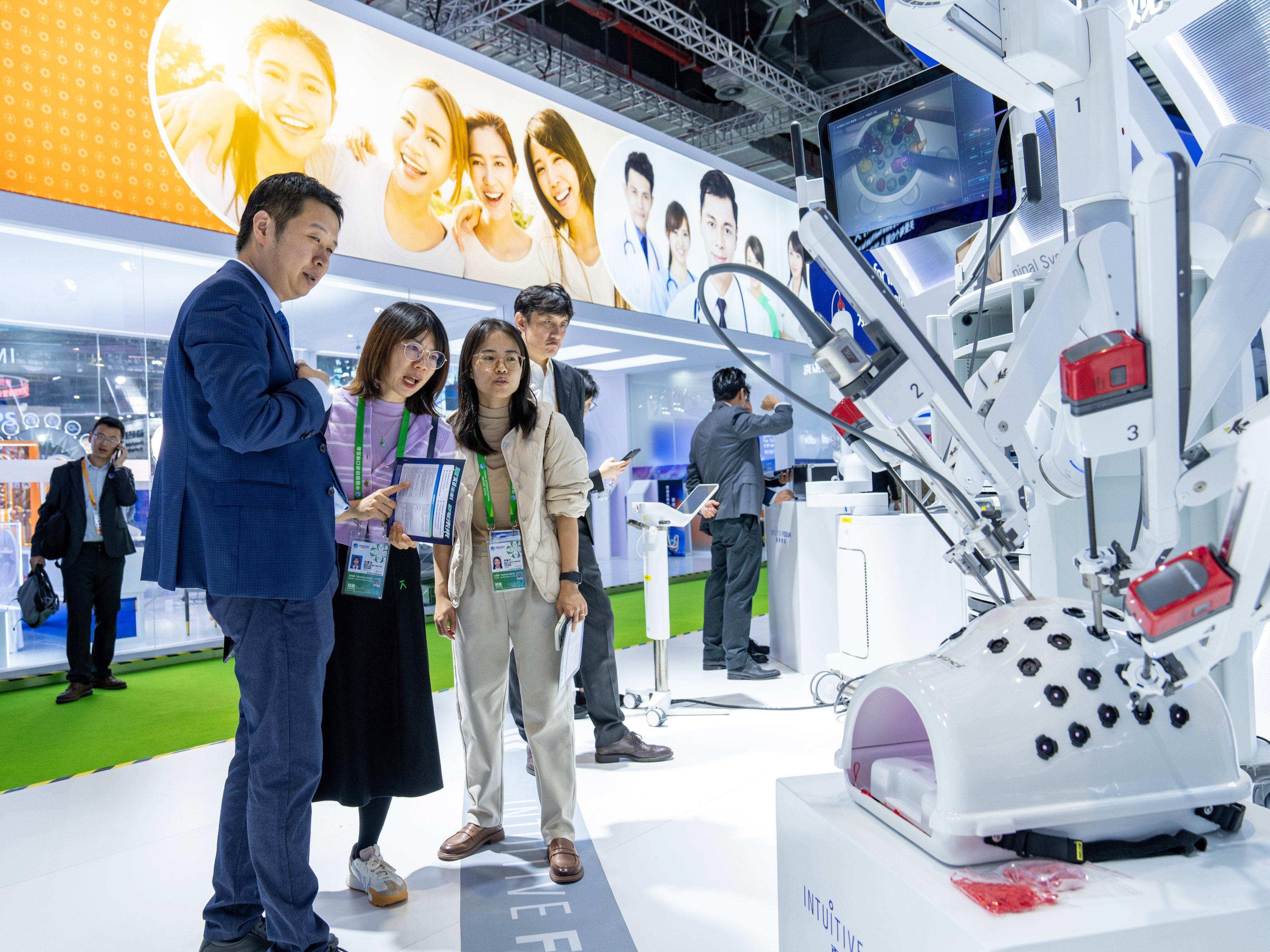 Visitors looking at Fosun Pharma’s locall-produced Da Vinci surgical system in the Medical Equipment and Healthcare Exhibition Area during the CIIE 2023 Expo in Shanghai on November 6. Shanghai, China. Photo: Future Publishing via Getty Images