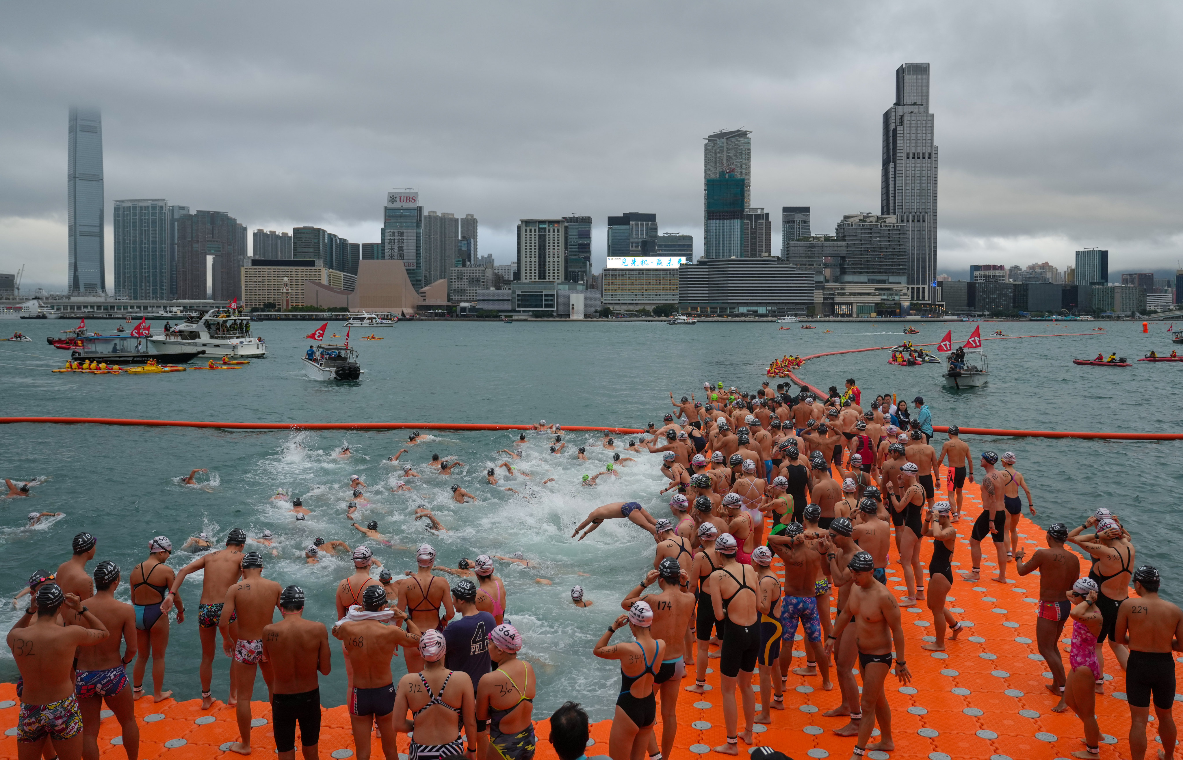 Swimmers prepare to start the New World Harbour Race from Wan Chai on Sunday. Photo: Sam Tsang