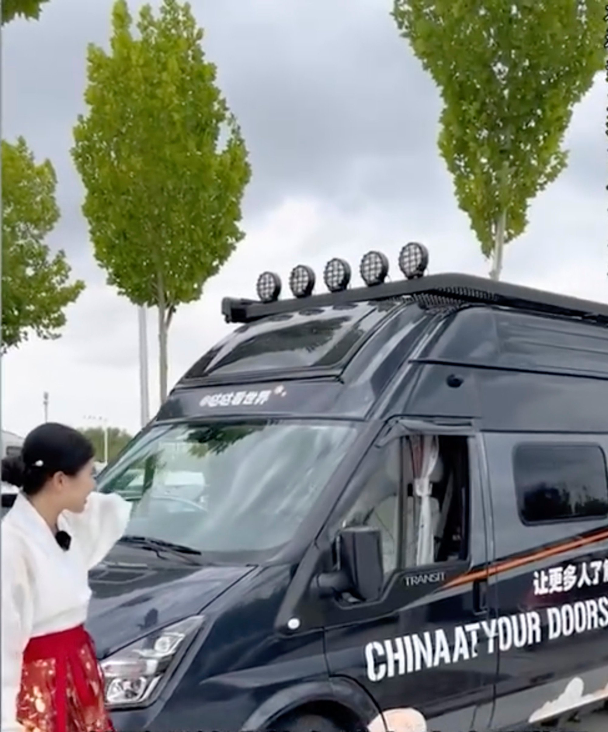 Yang Yue travels in a van emblazoned with slogans inviting people around the world to engage with Chinese culture. Photo: Sina