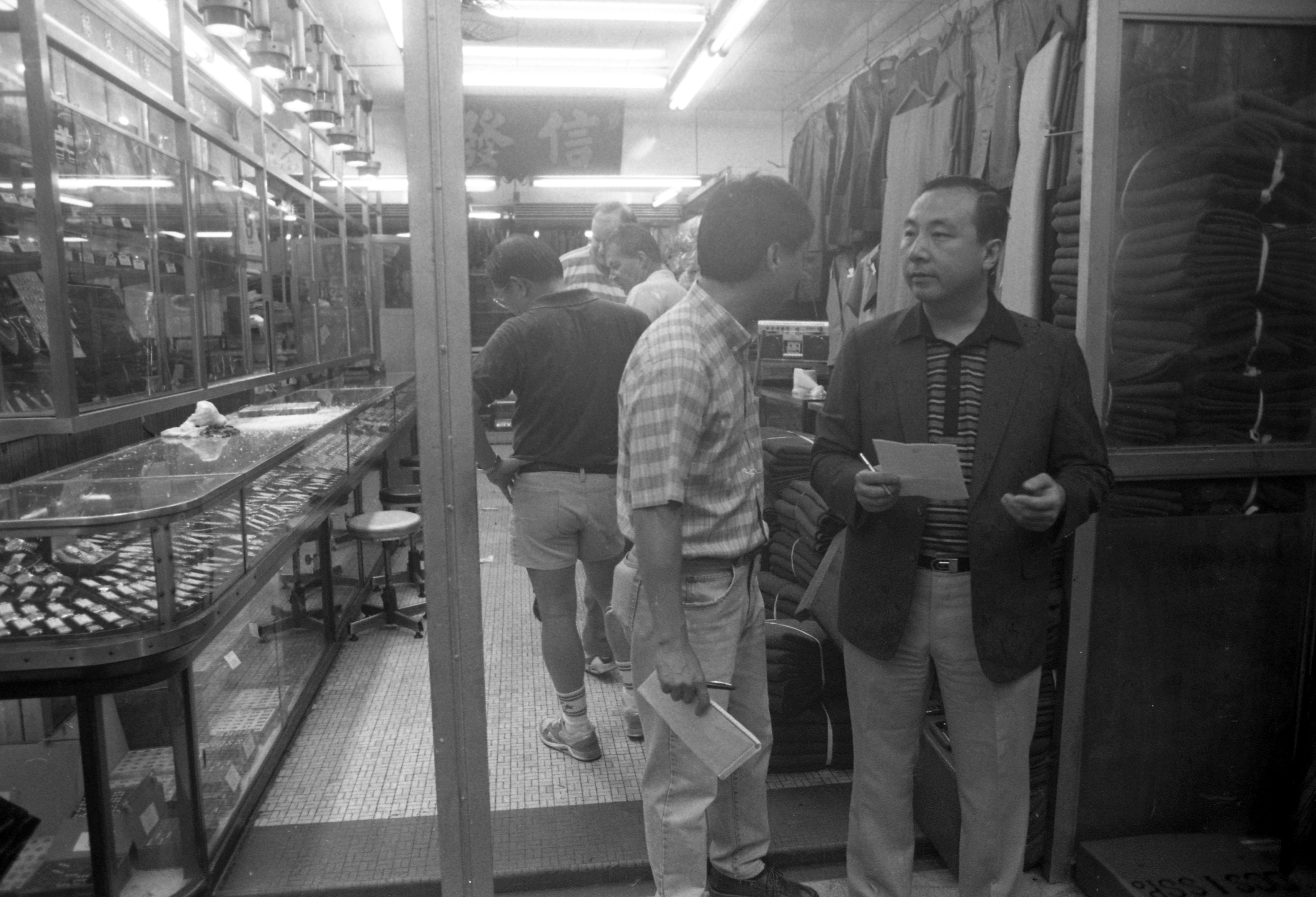 Flashback: Detectives examine the scene of a murder/attempted robbery at a watch store in Sham Shui Po in 1991. Photo: Wan Kam-yan.
