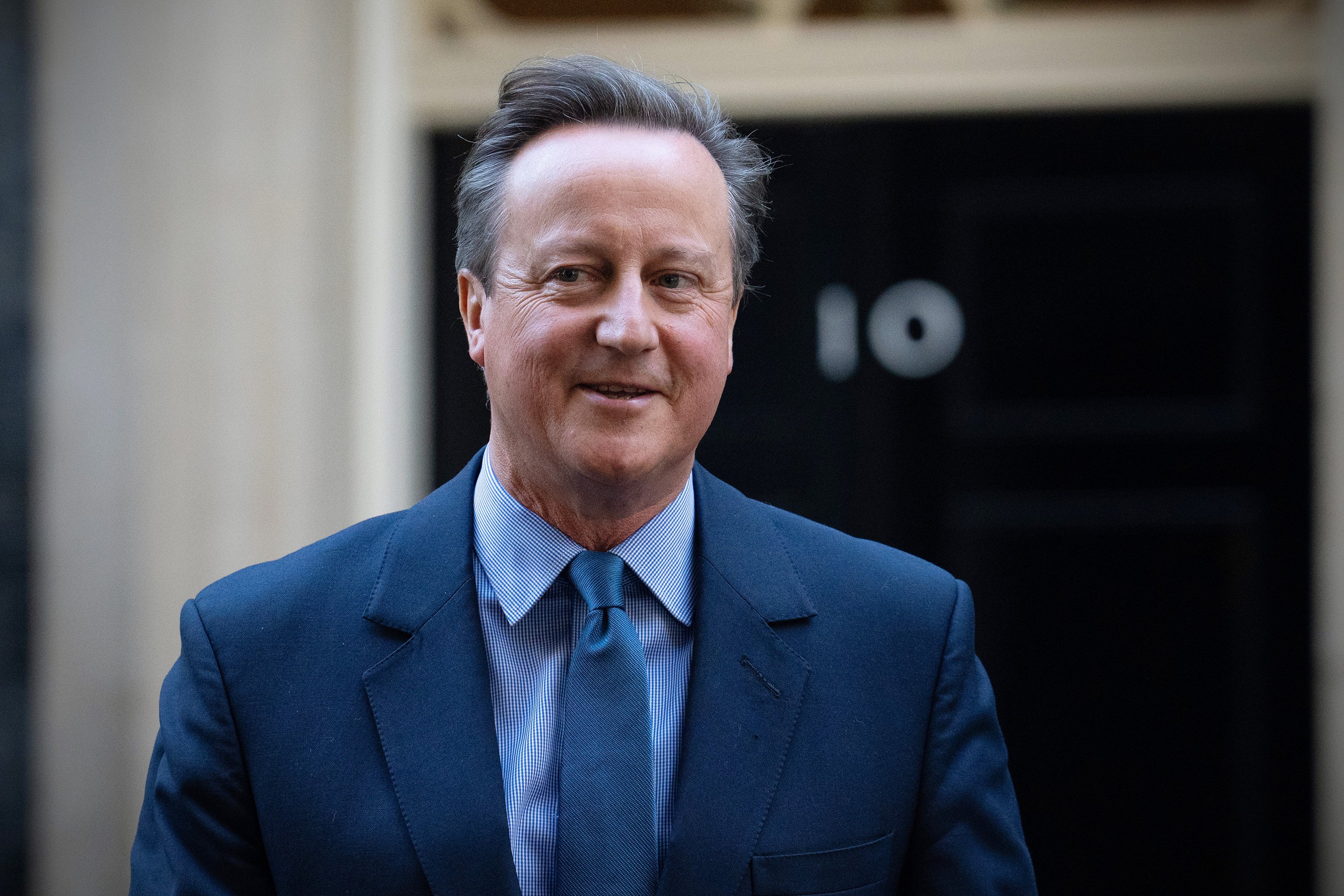 David Cameron, Britain’s former prime minister, leaves 10 Downing Street after being appointed foreign secretary on Monday. Photo: Getty Images / TNS