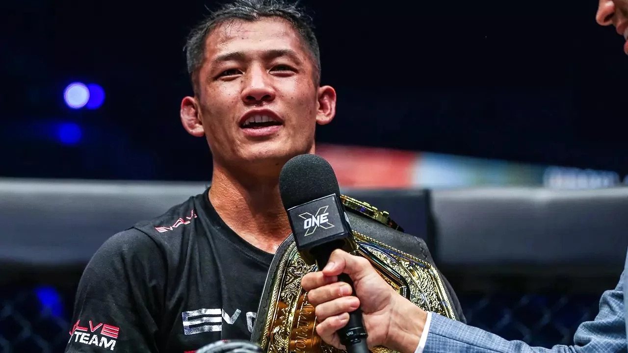 Hiroki Akimoto speaks to ONE Championship commentator Mitch Chilson after claiming the promotion’s bantamweight kickboxing belt in 2022. Photo: ONE Championship